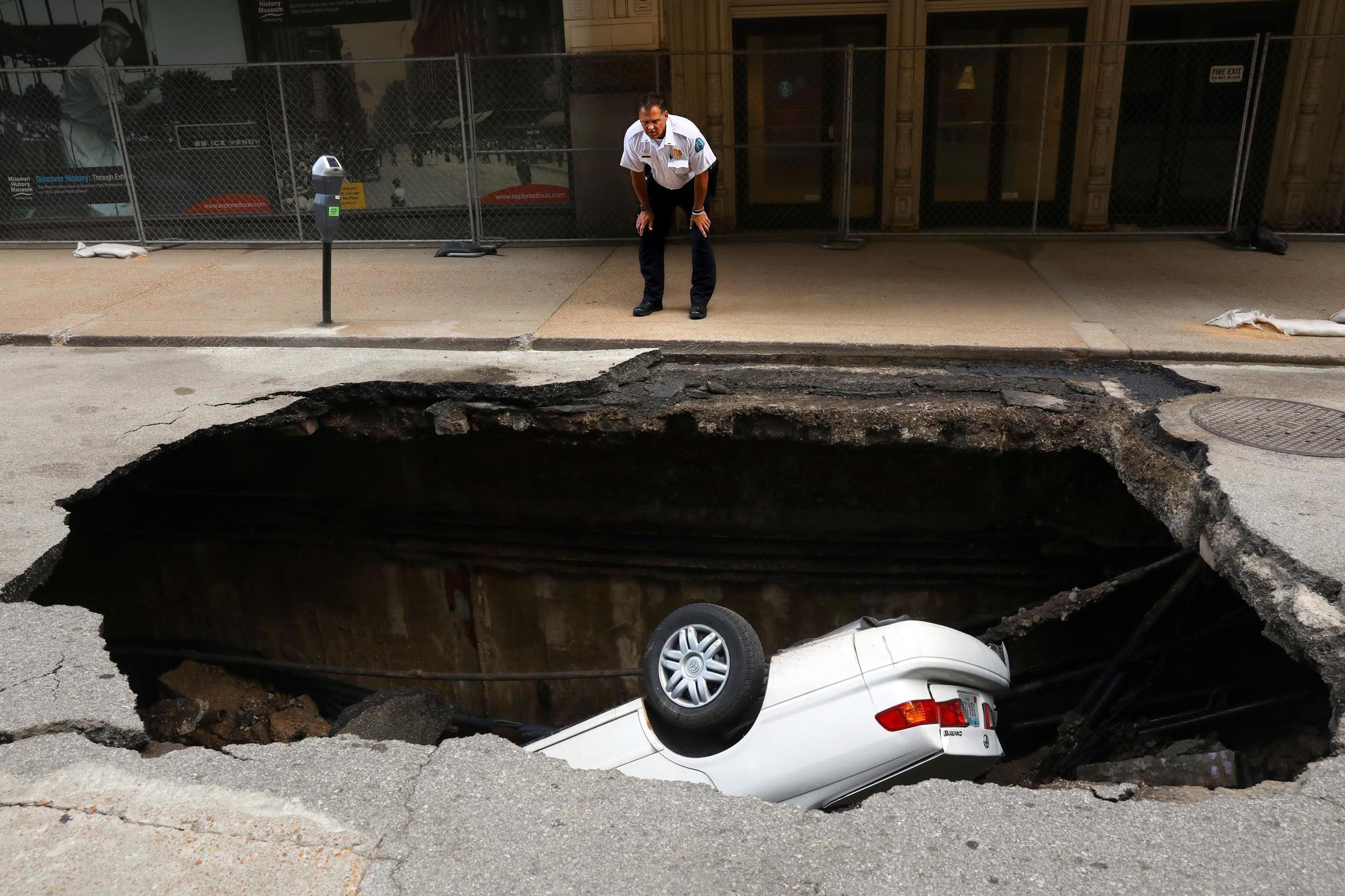 Huge sinkhole opens up and swallows car in major US city