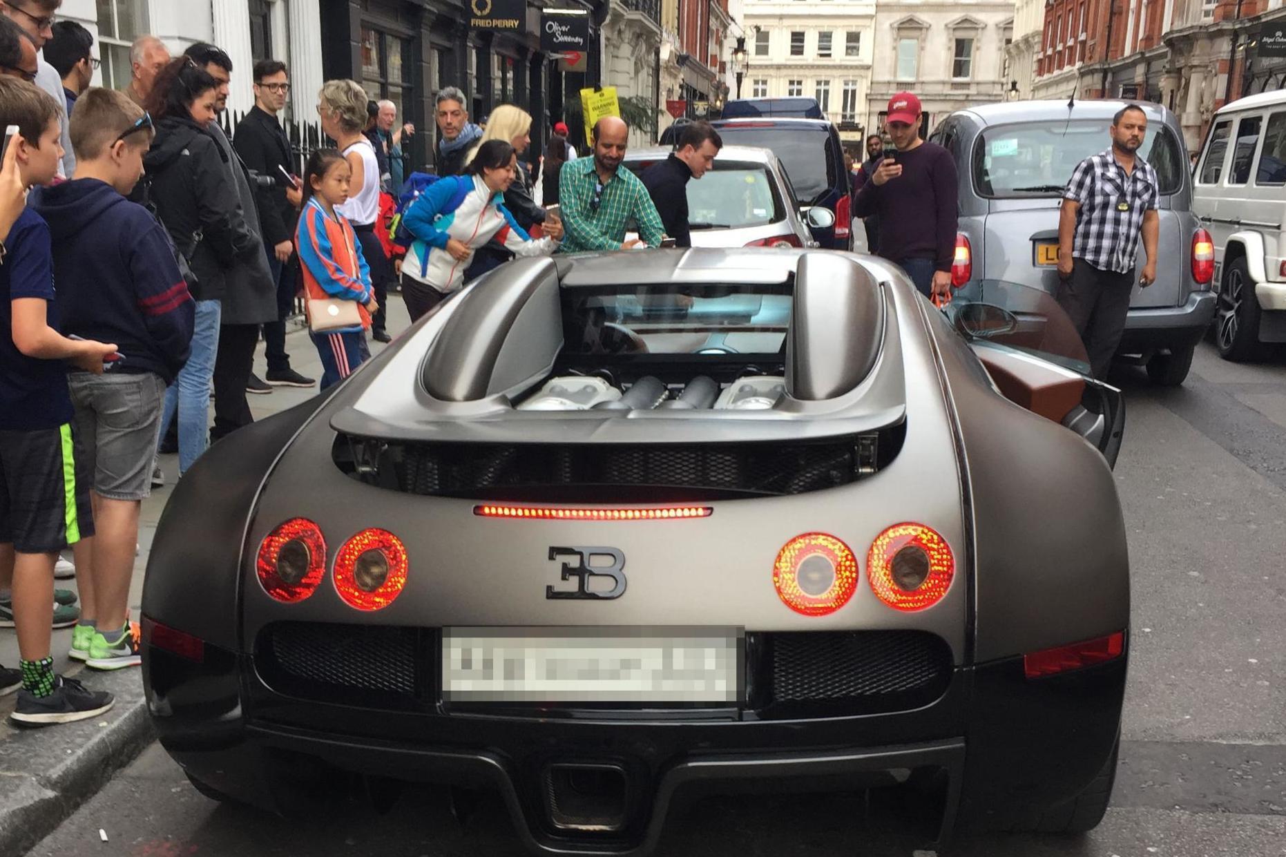 Smiling passers-by look on as £2m supercar fleet is slapped with fines