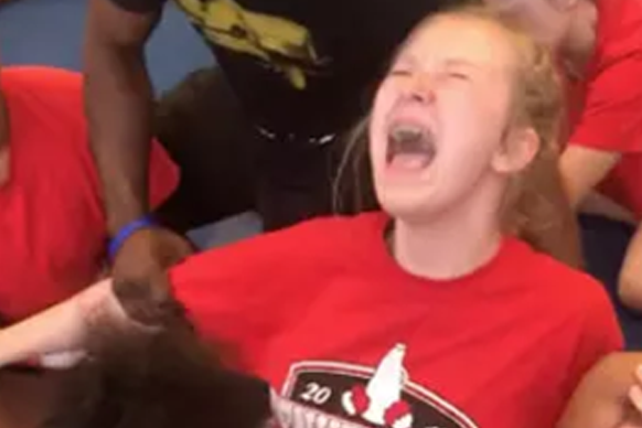 High school coach fired after harrowing footage emerges of cheerleaders being held down and forced to do splits | London Evening Standard