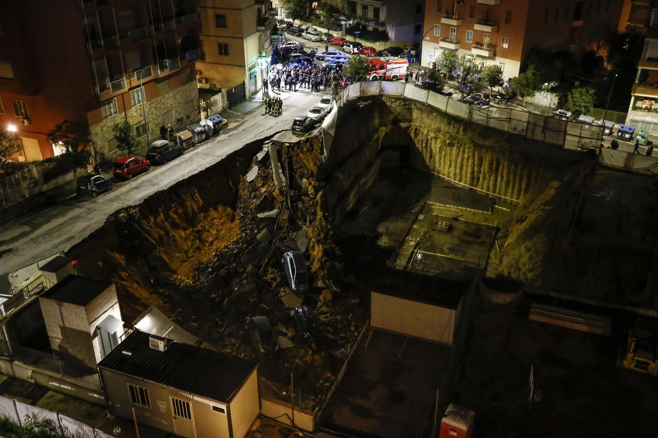 Enormous 30ft sinkhole swallows cars and sparks evacuations in Rome