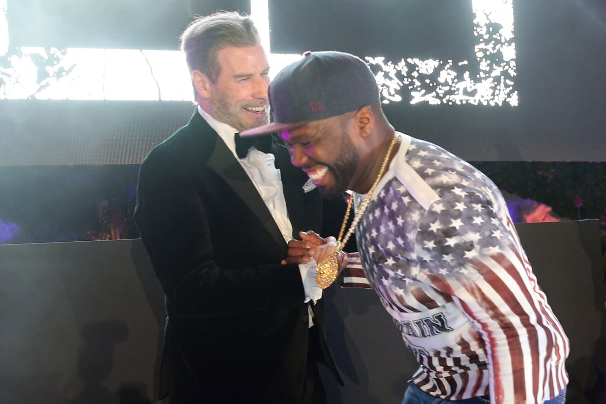 John Travolta shows off his best awkward dad dancing as he joins 50 Cent on stage at Cannes party | London Evening Standard