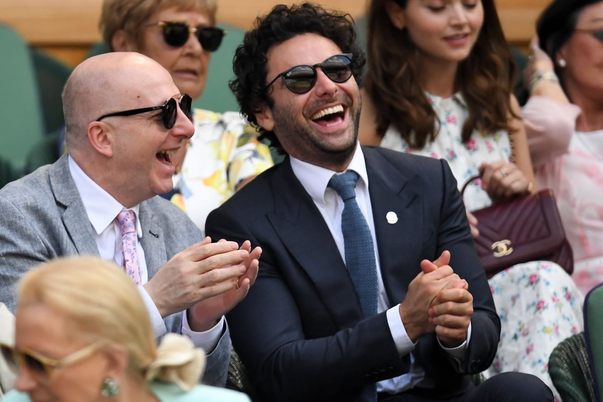 Aidan Turner cracks a joke with pal as he joins Jenna Coleman and Damian Lewis at Wimbledon | London Evening Standard