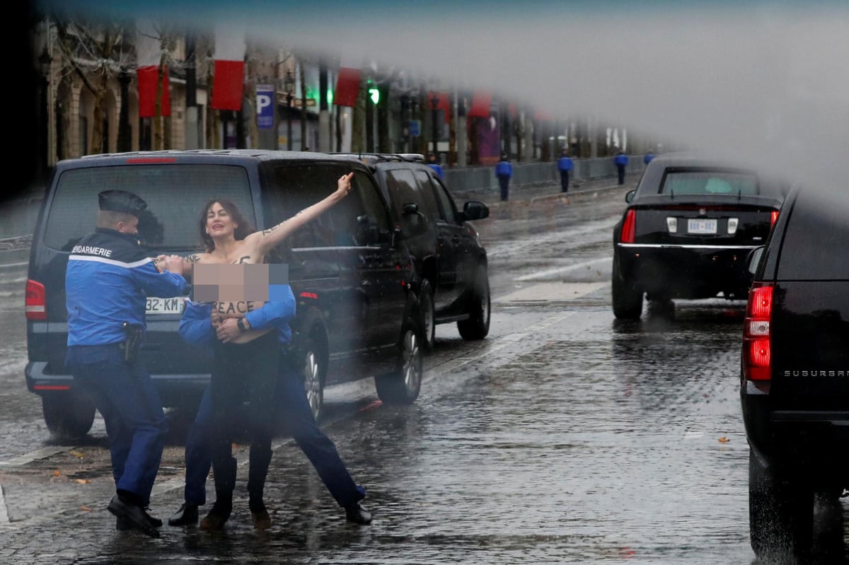 Donald Trump Remembrance Day: Topless protester leaps at the President’s motorcade in Paris as he makes his way to Armistice ceremony | London Evening Standard