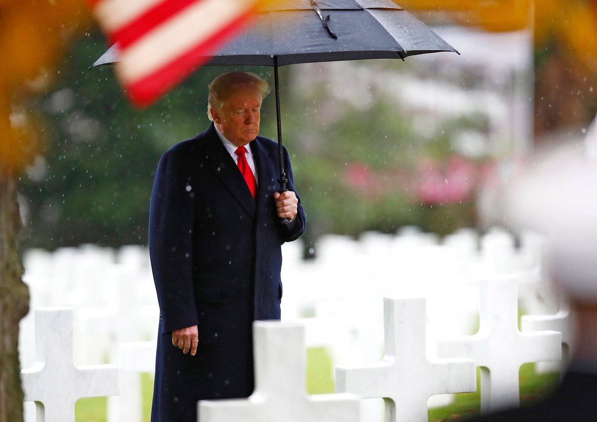 Donald Trump rain: President jokingly complains about 'getting drenched' at Armistice ceremony a day after cancelling cemetery trip due to bad weather | London Evening Standard