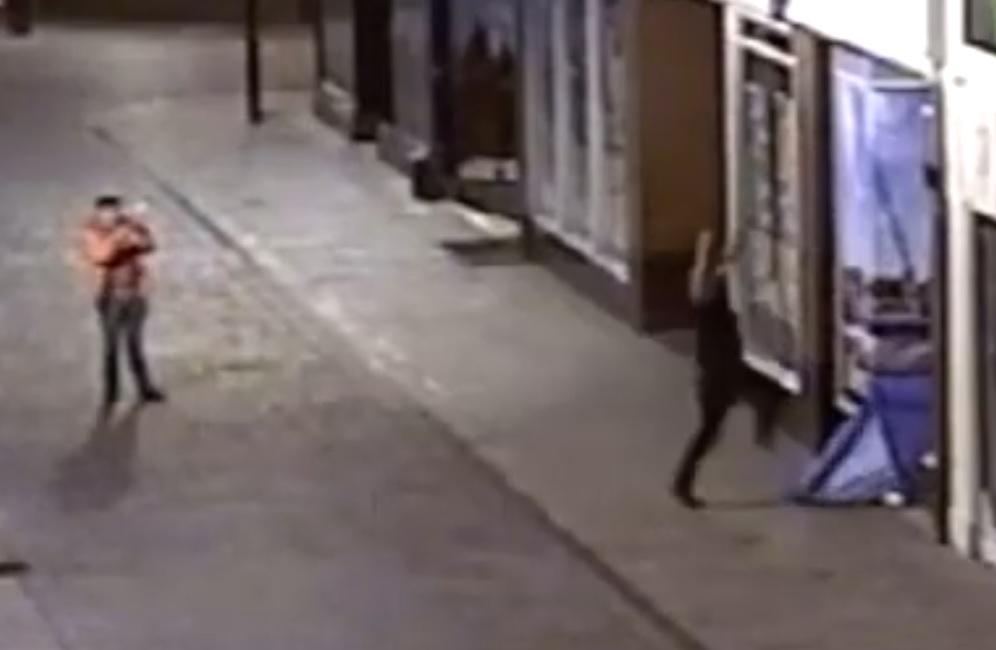 Shocking moment thug drop-kicks homeless tent as two sleep inside