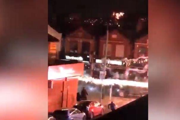 Moment people flee as thugs hurl fireworks along high street in Ilford | London Evening Standard