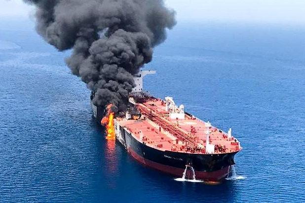 Gulf of Oman oil tanker attack: US military releases video 'showing Iranian navy boat removing unexploded mine from tanker' | London Evening Standard