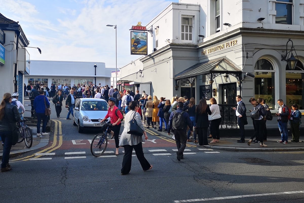 South Western Railway strike sparks rush-hour misery as commuters forced to form huge 200m queues along Surbiton high street | London Evening Standard