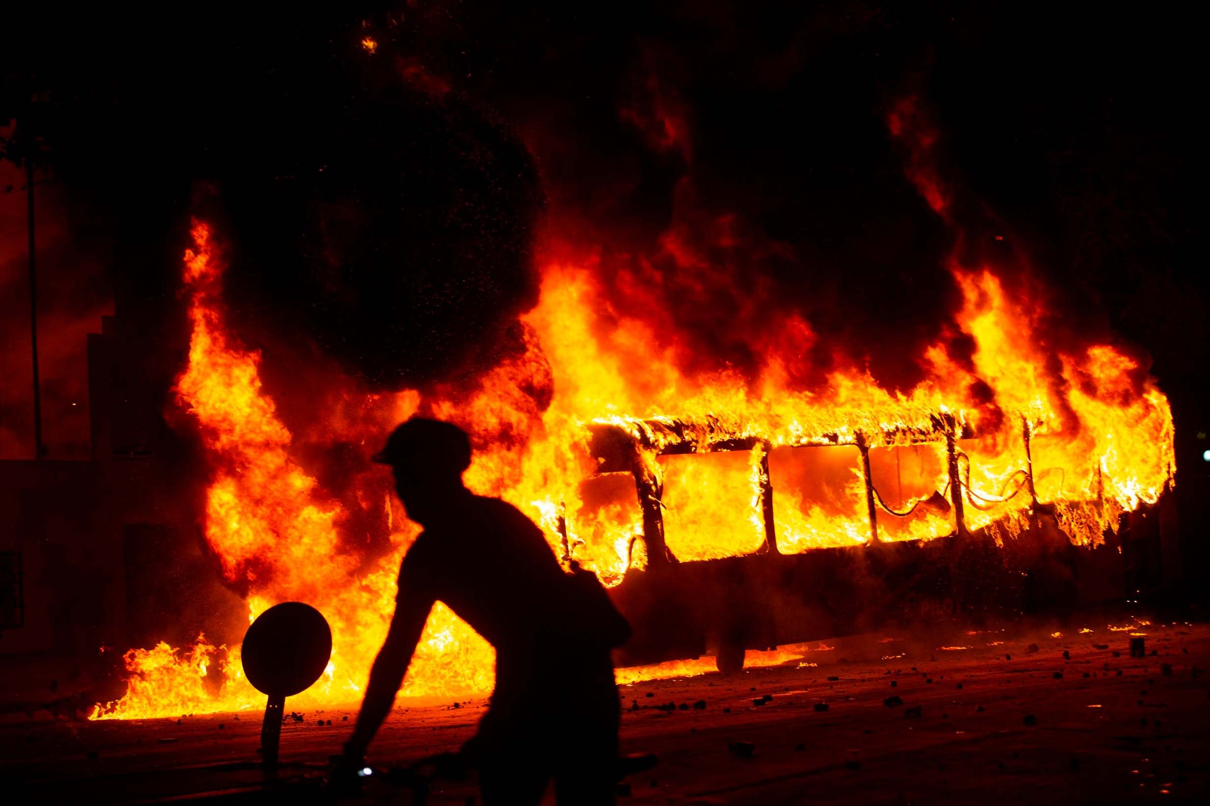 Three killed in supermarket blaze as violent riots engulf Chile