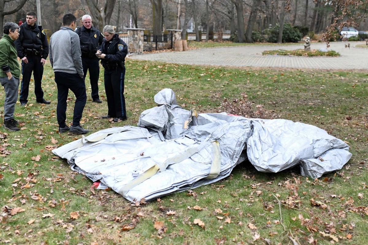 Evacuation slide falls from airliner and lands feet away from woman in garden | London Evening Standard