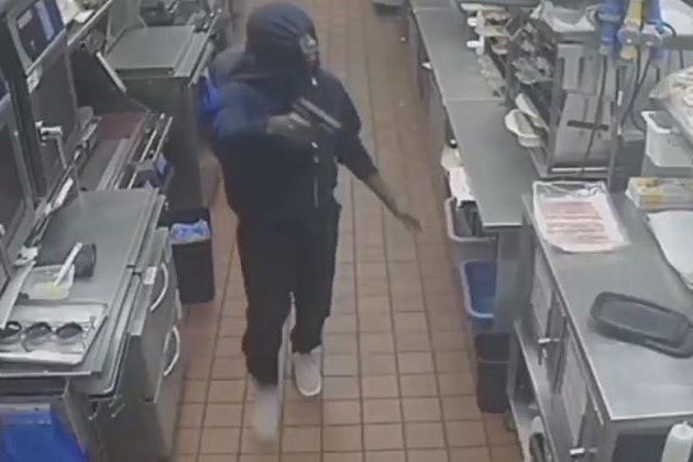 CCTV footage shows intruder gunman climbing into McDonald's through drive-thru window | London Evening Standard