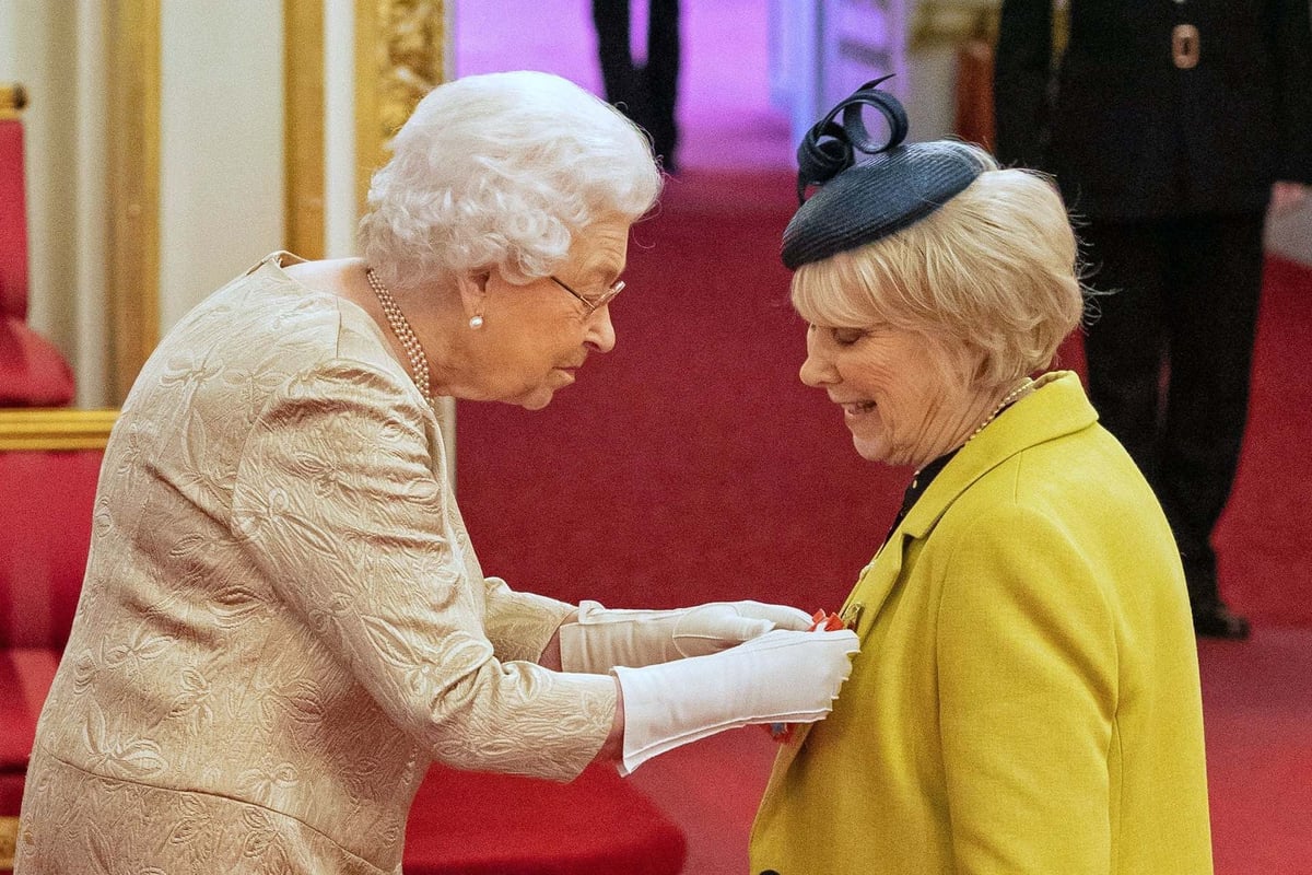 Queen wears extra-long gloves to hand out honours at Buckingham Palace amid coronavirus hygiene fears | London Evening Standard