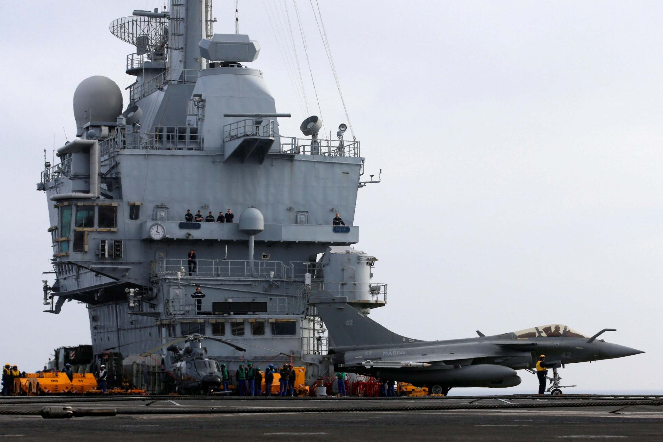 Flagship aircraft carrier stricken as French death toll passes 10,000