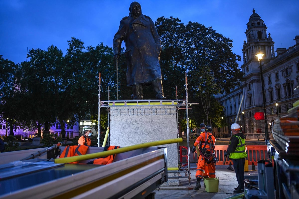 Winston Churchill statue boarded up ahead of planned protests in London amid calls to topple 'racist' monuments | London Evening Standard