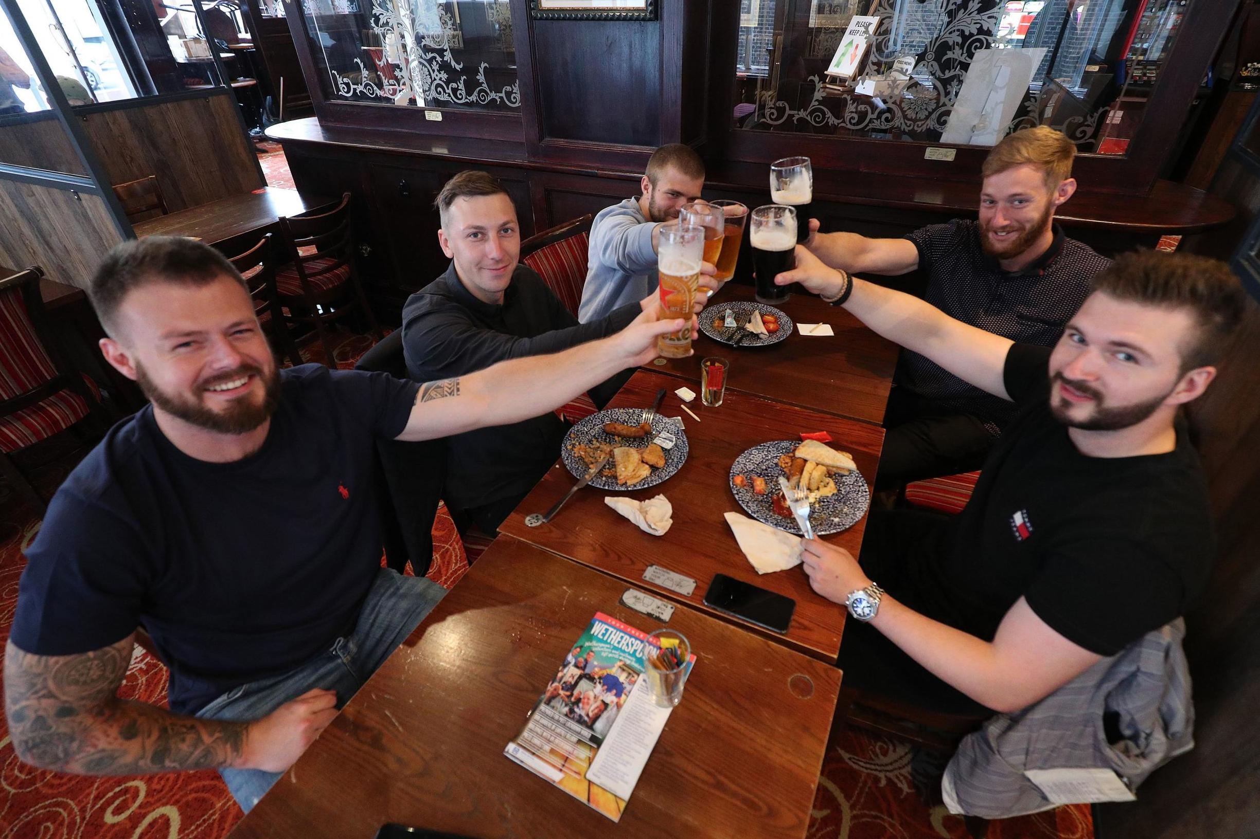 London's first pint? Pubs open their doors for 'Super Saturday'