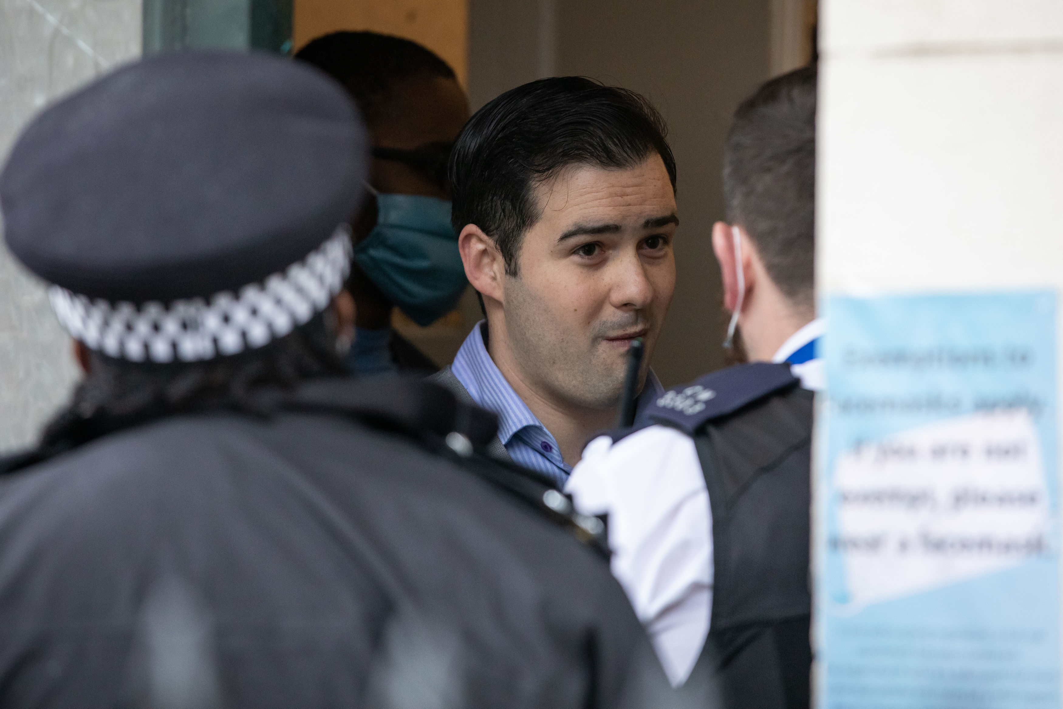 Angel pastor argues with police as officers break up lockdown baptism
