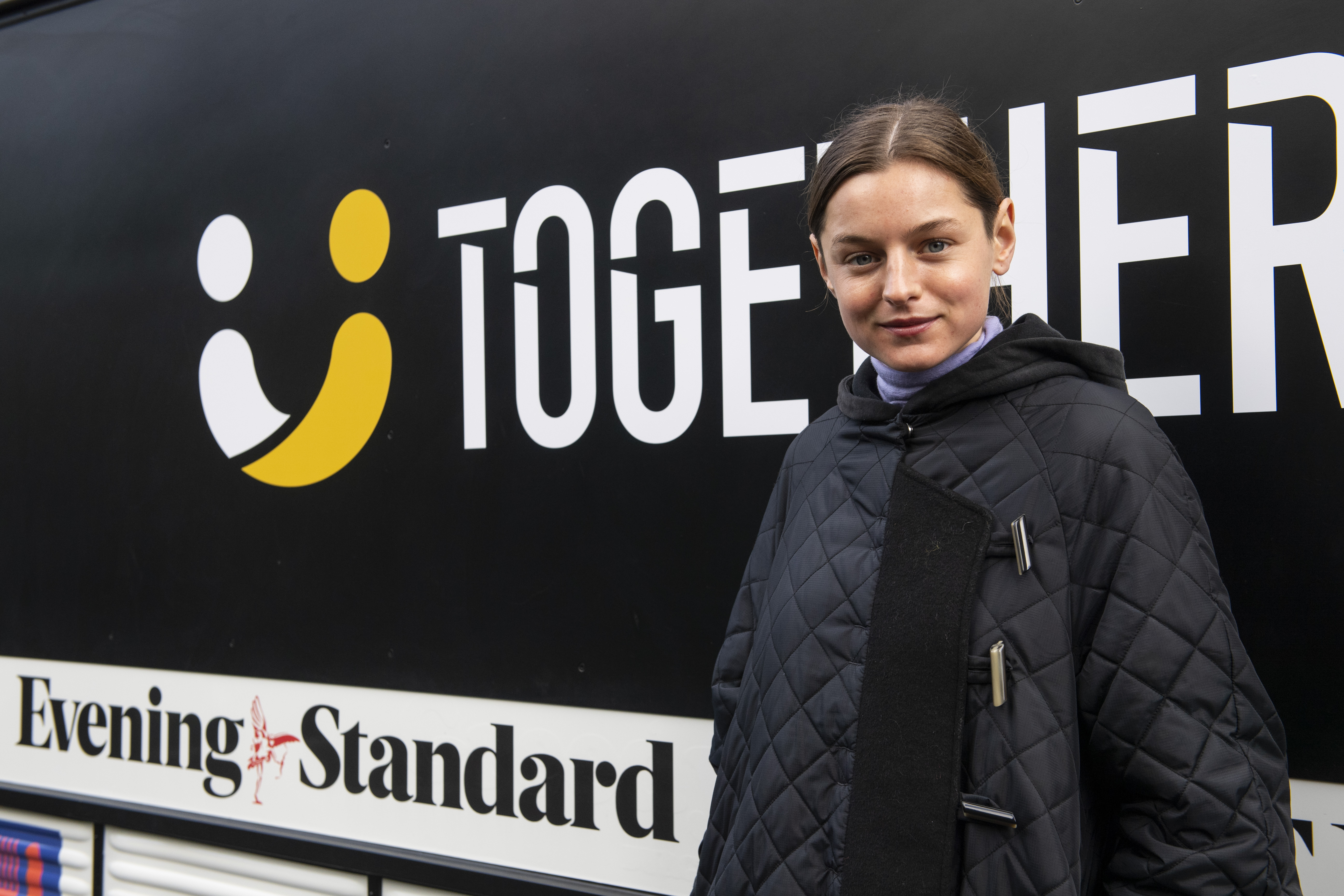 Emma Corrin helps distribute cooked food outside Ringcross Community Centre Food Bank, Islington
