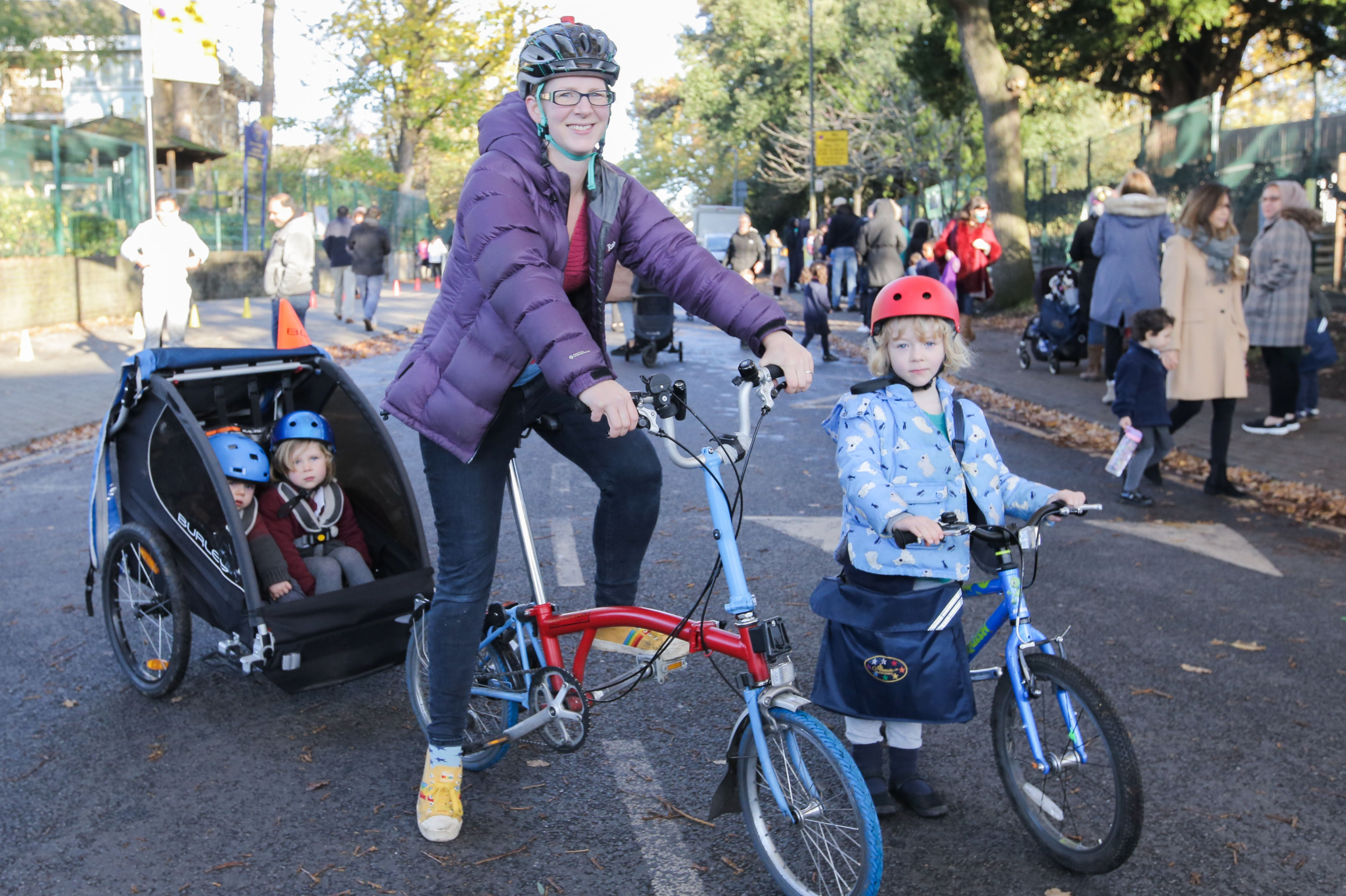 Lisa Gatward and her daughter Ariadne arrive at school in Wimbledon on their bikes