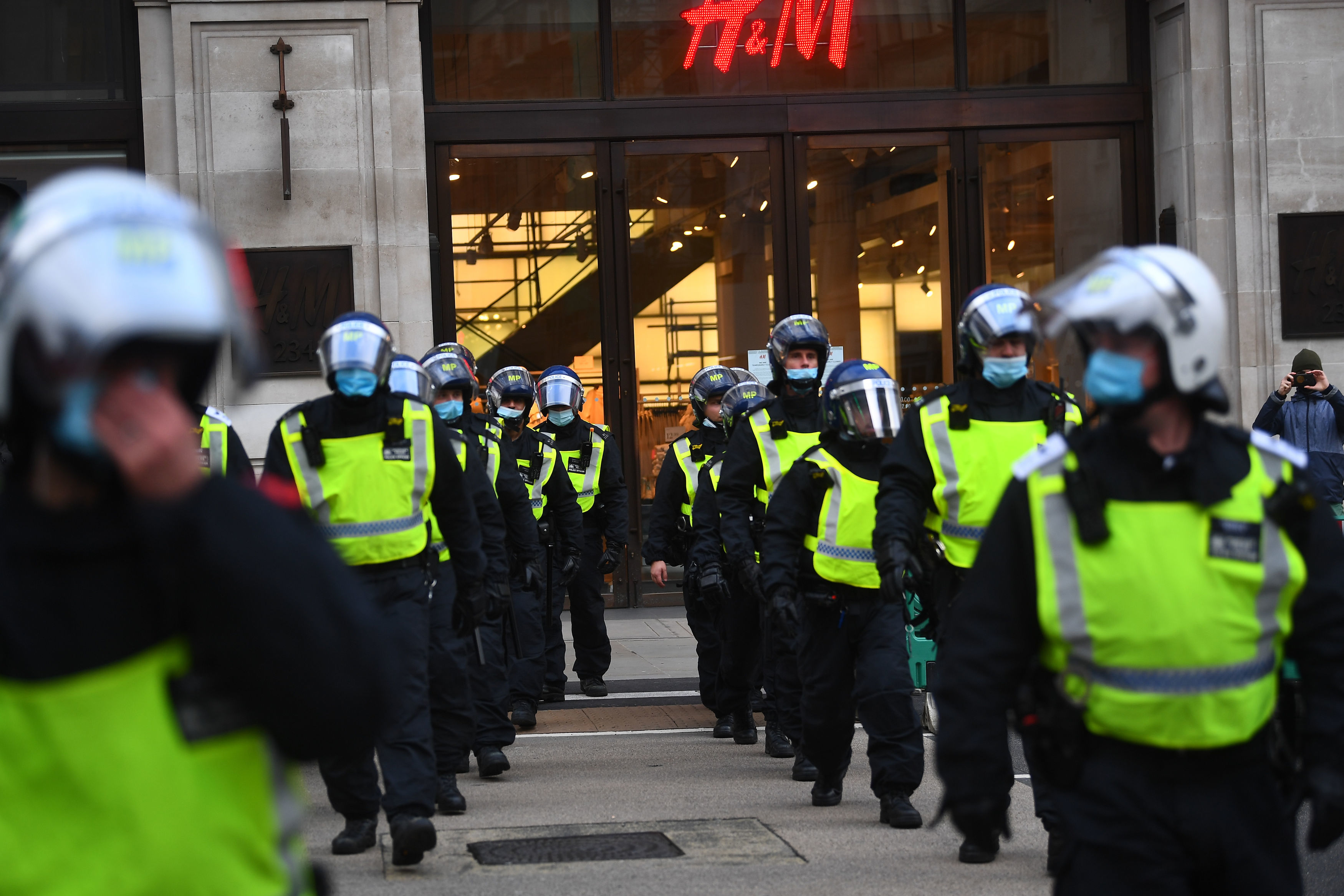 UK virus death toll jumps by 479 as heated protests sweep London