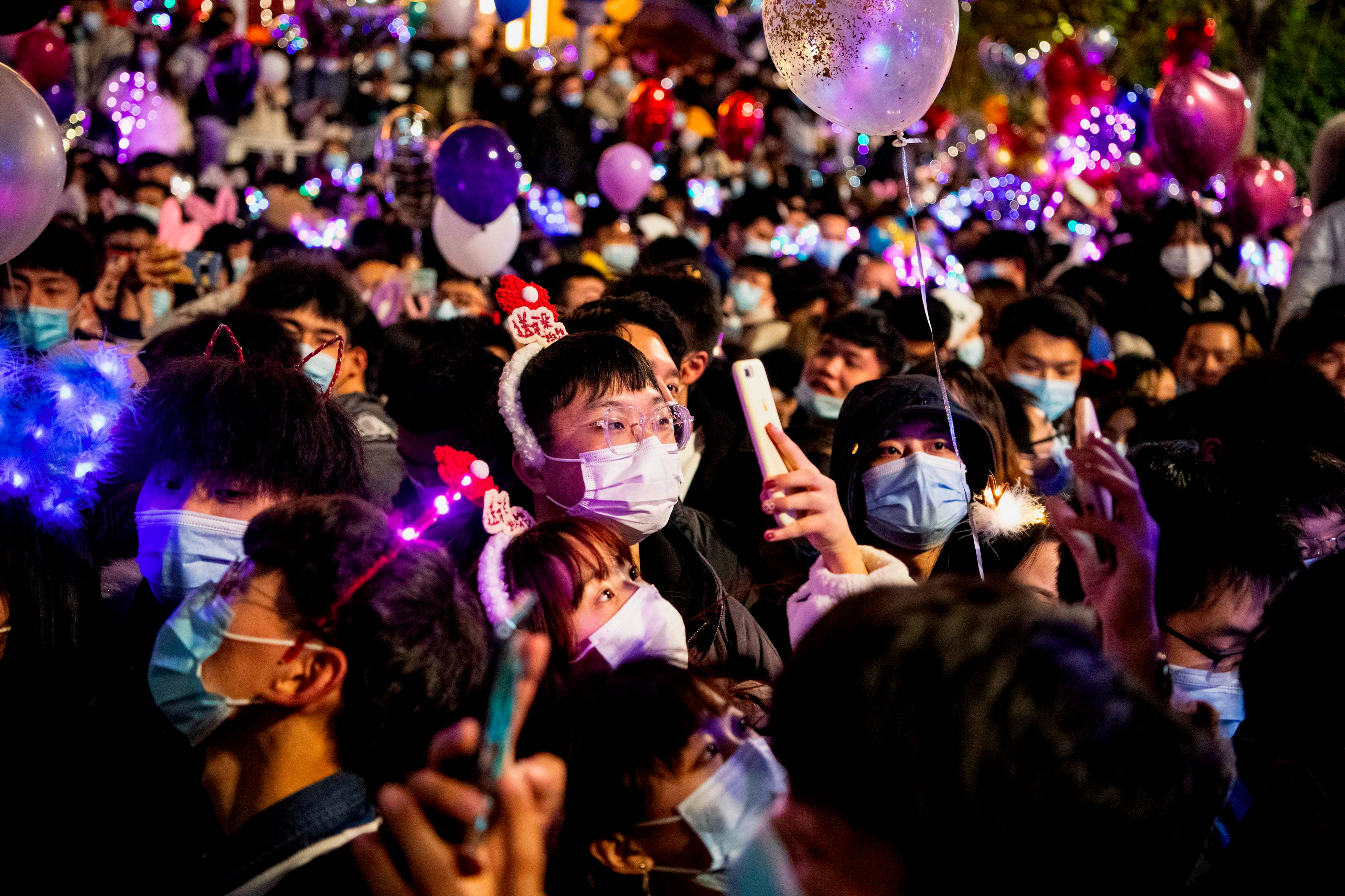 Thousands gather on streets of Wuhan to celebrate on New Year’s Eve 