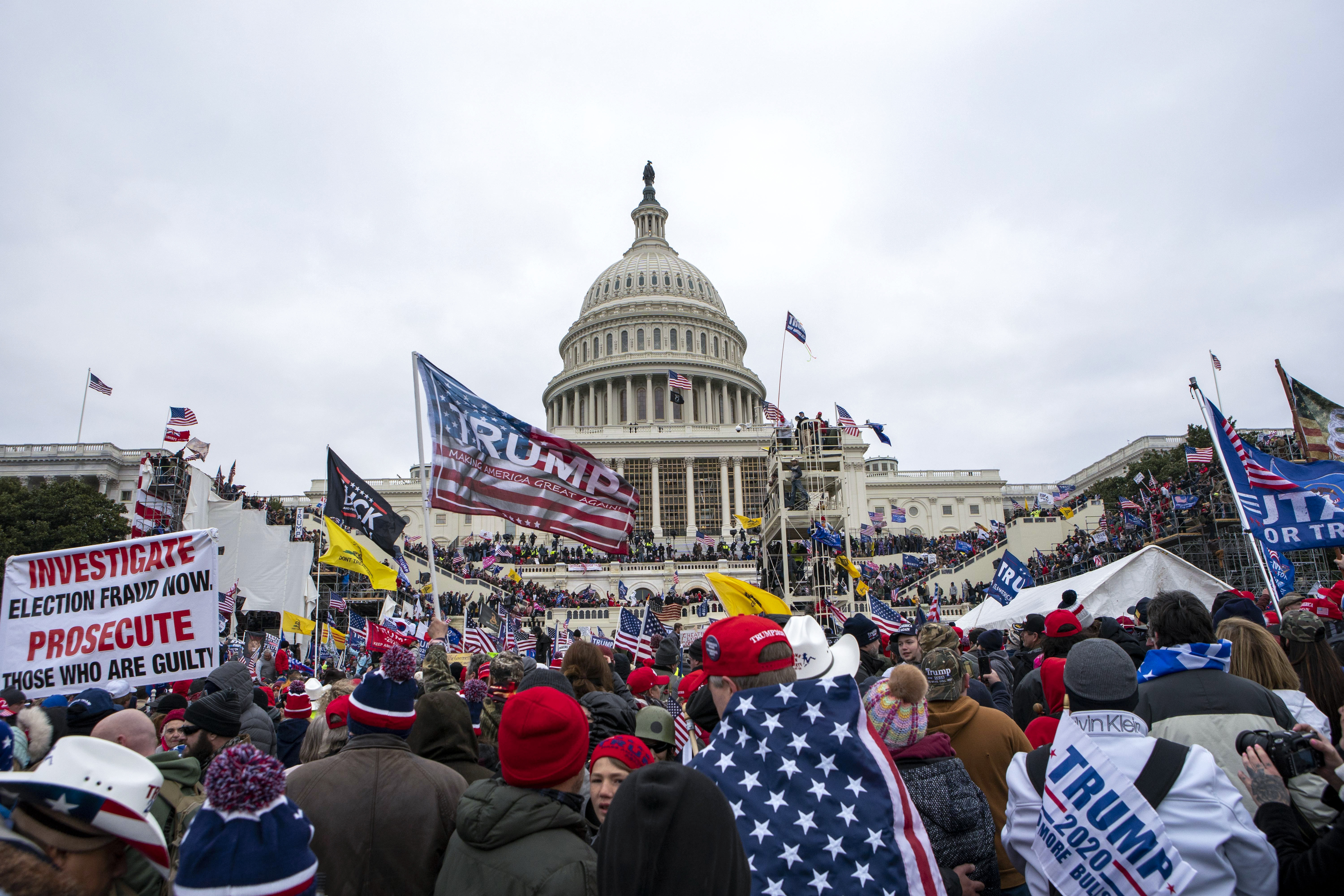 US Capitol reaction: Four dead as former presidents condemn riots
