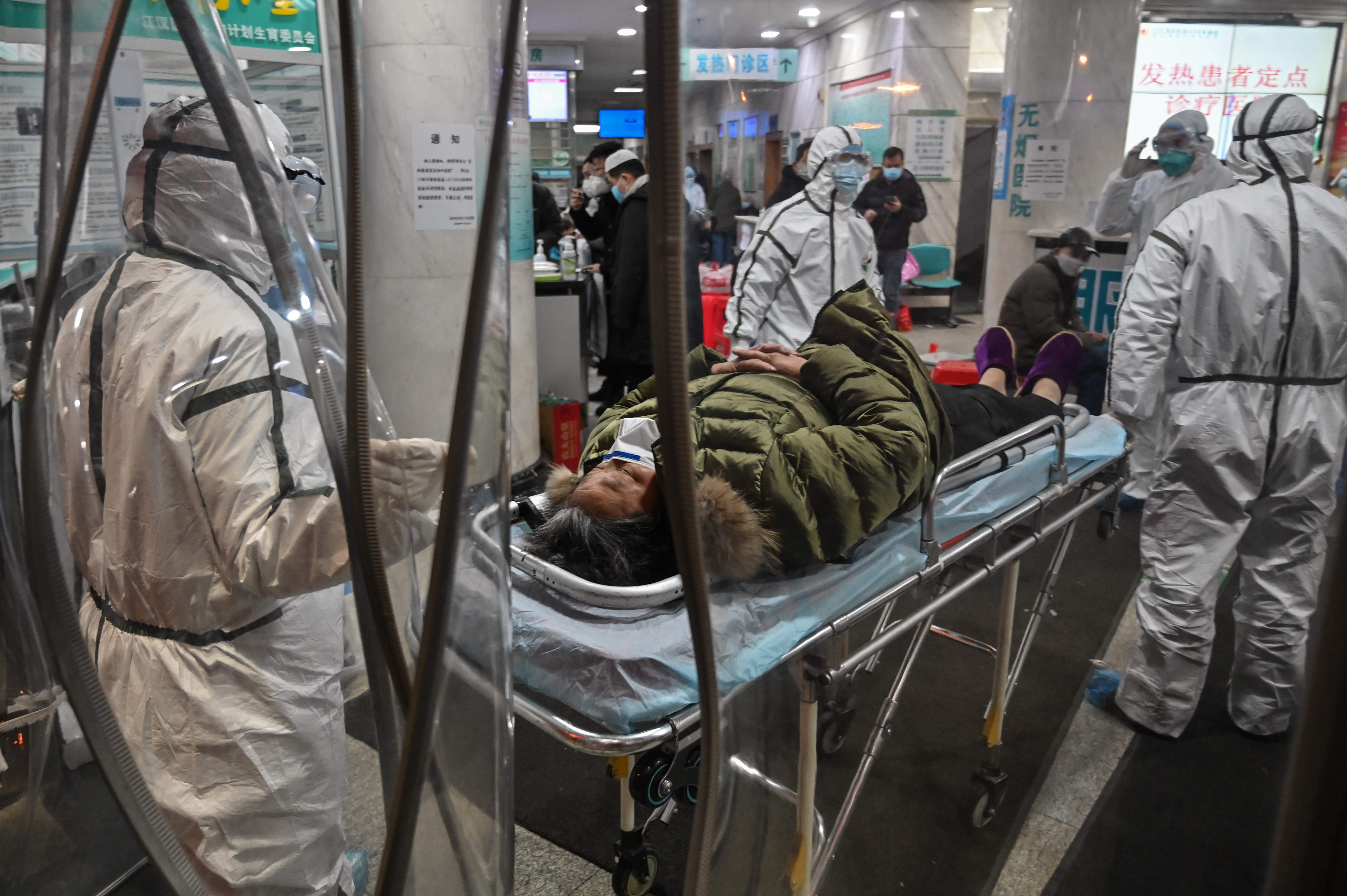 China allows WHO experts probing virus origins to visit country