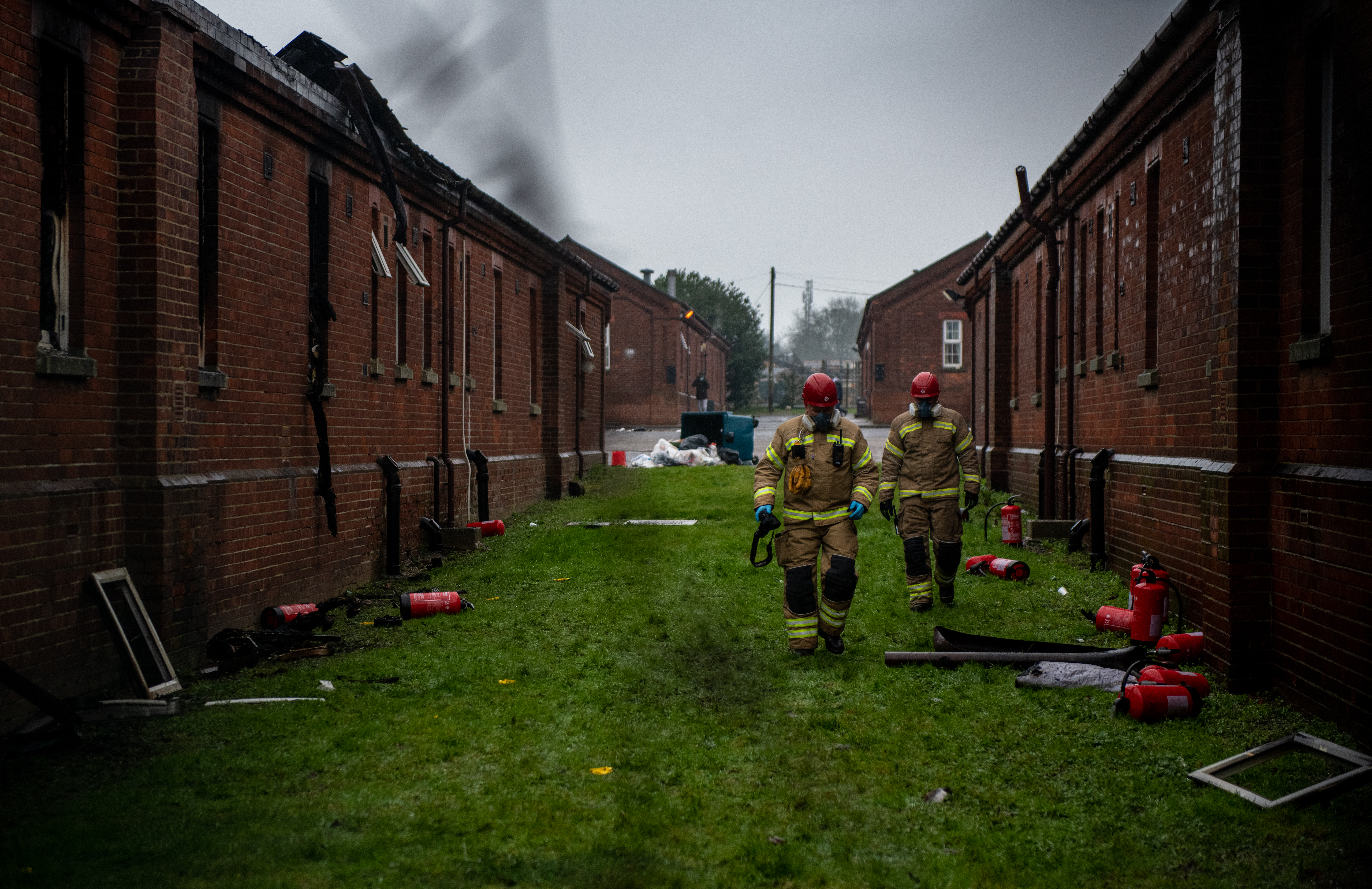Five arrested after fire at virus-hit barracks housing asylum seekers