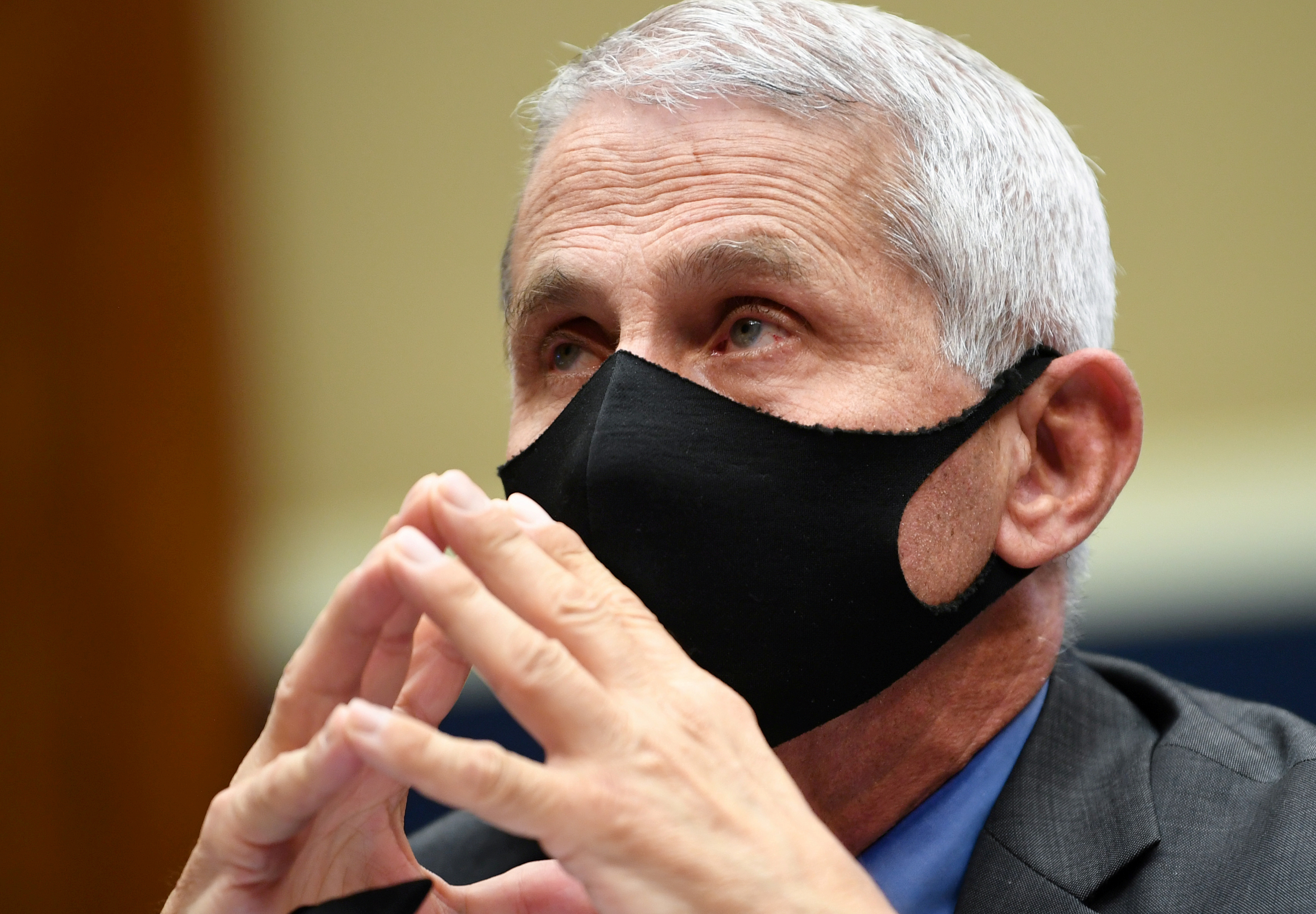 Americans could be wearing masks in 2022, Dr Anthony Fauci warns as US death toll nears 500,000