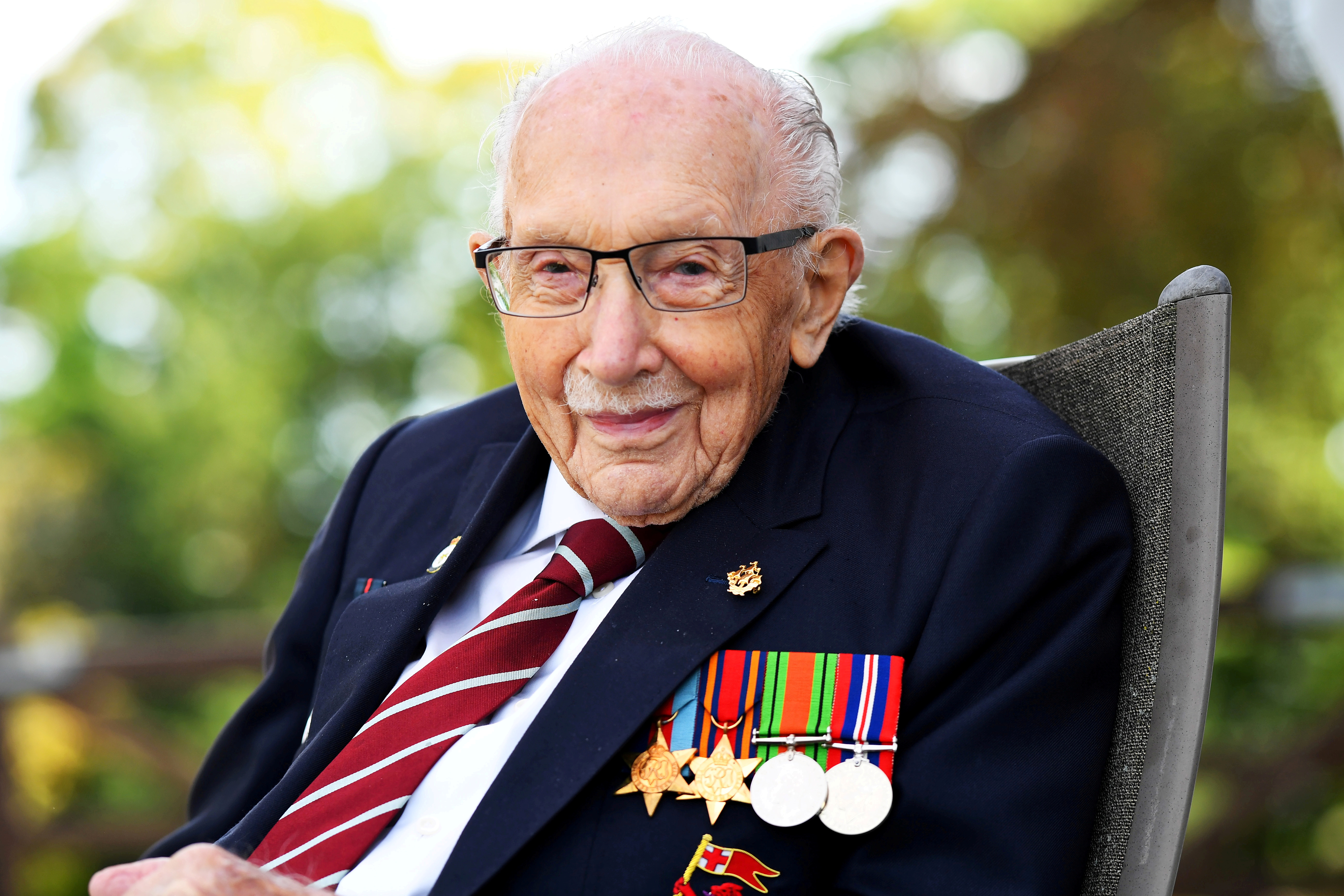 FILE PHOTO: Captain Sir Tom Moore smiles as he launches his autobiography at his home in Milton Keynes