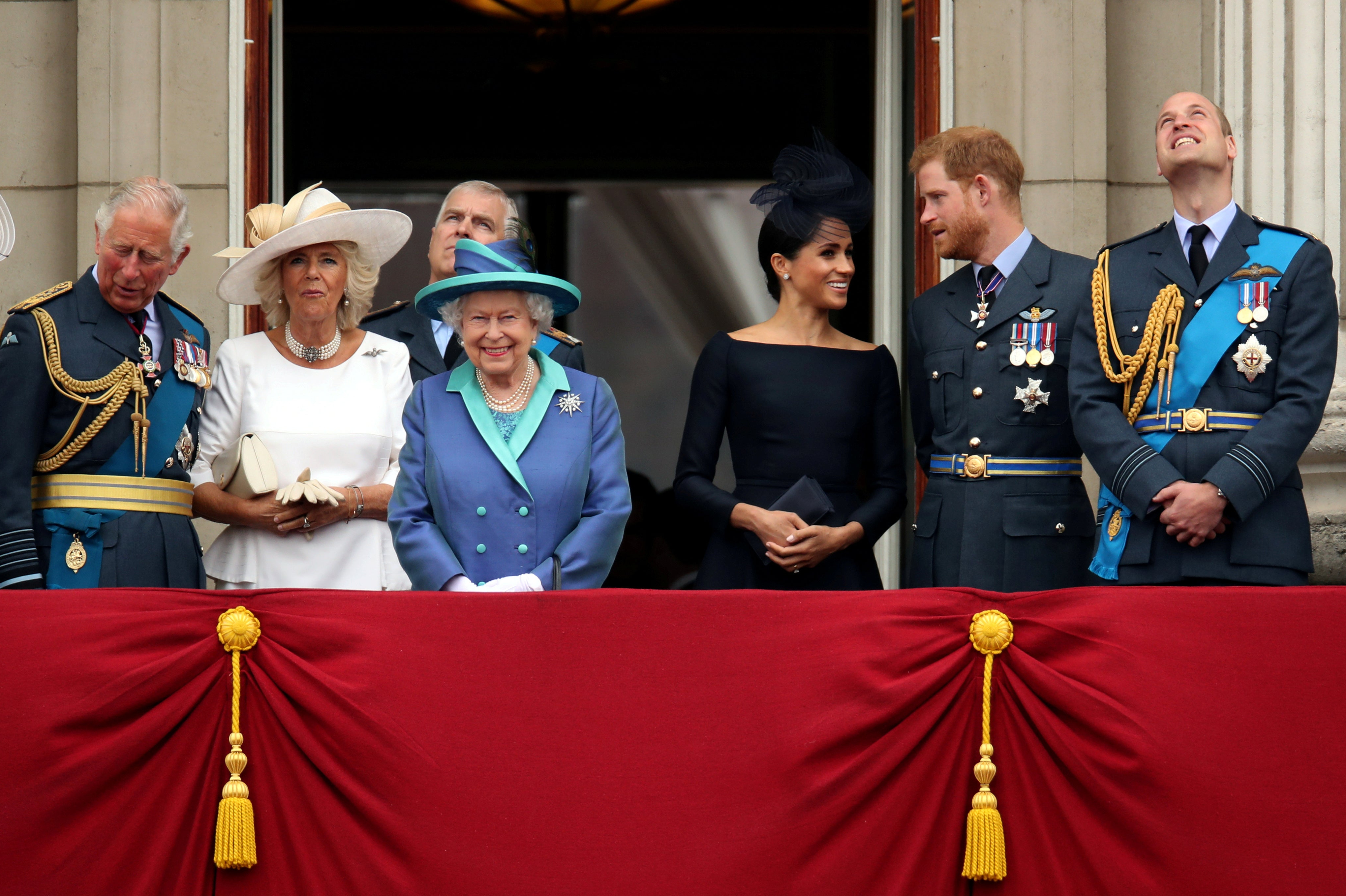 FILE PHOTO: Britain's Queen Elizabeth is joined by members of the Royal Family on the balcony of Buckingham Palace as they watch a fly past to mark the centenary of the Royal Air Force in central London