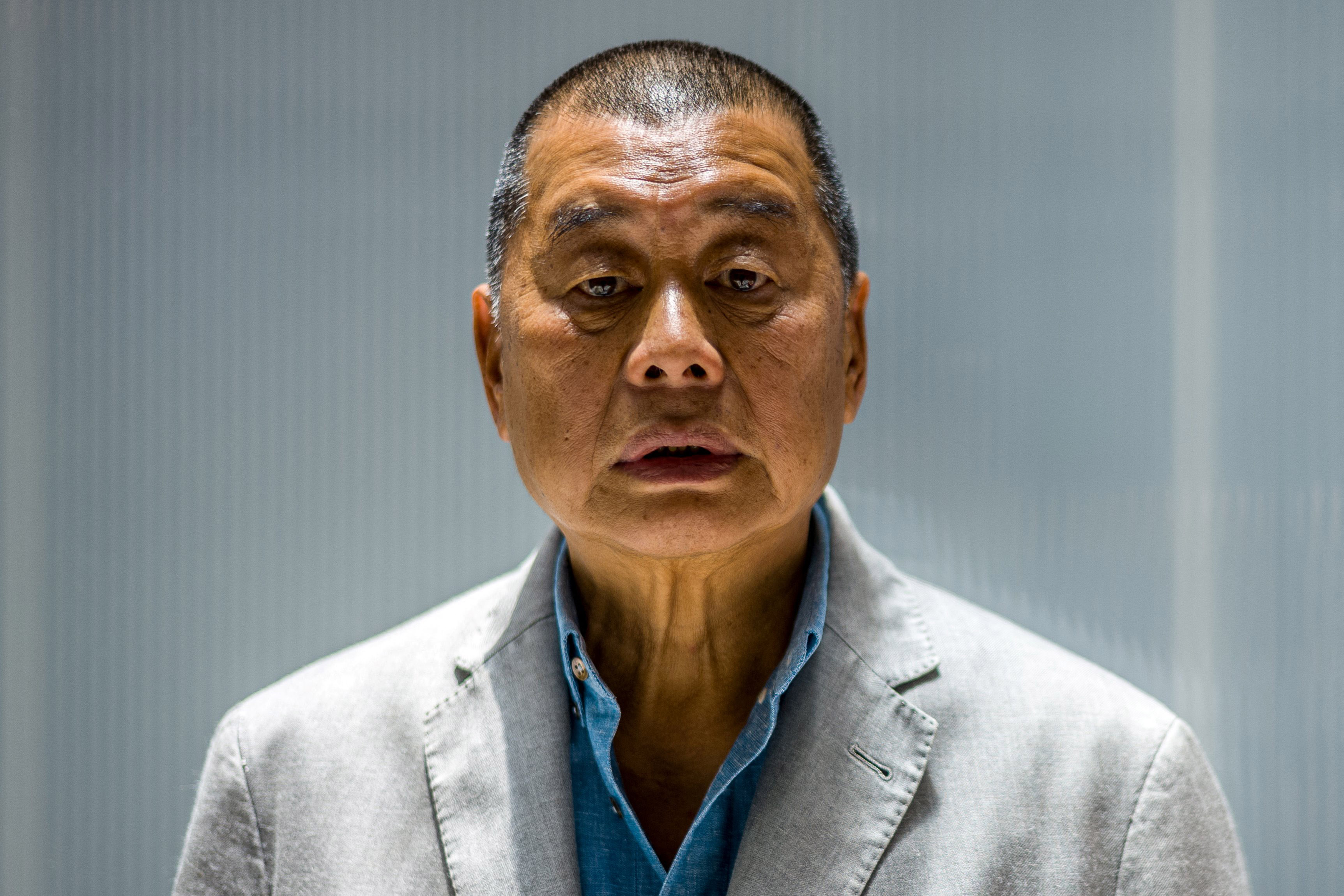 Hong Kong pro-democracy tycoon Jimmy Lai jailed for 14 months