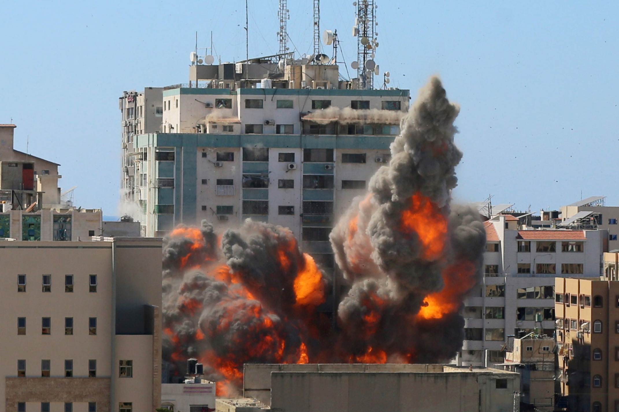 A tower housing AP, Al Jazeera offices collapses after Israeli missile strikes in Gaza city