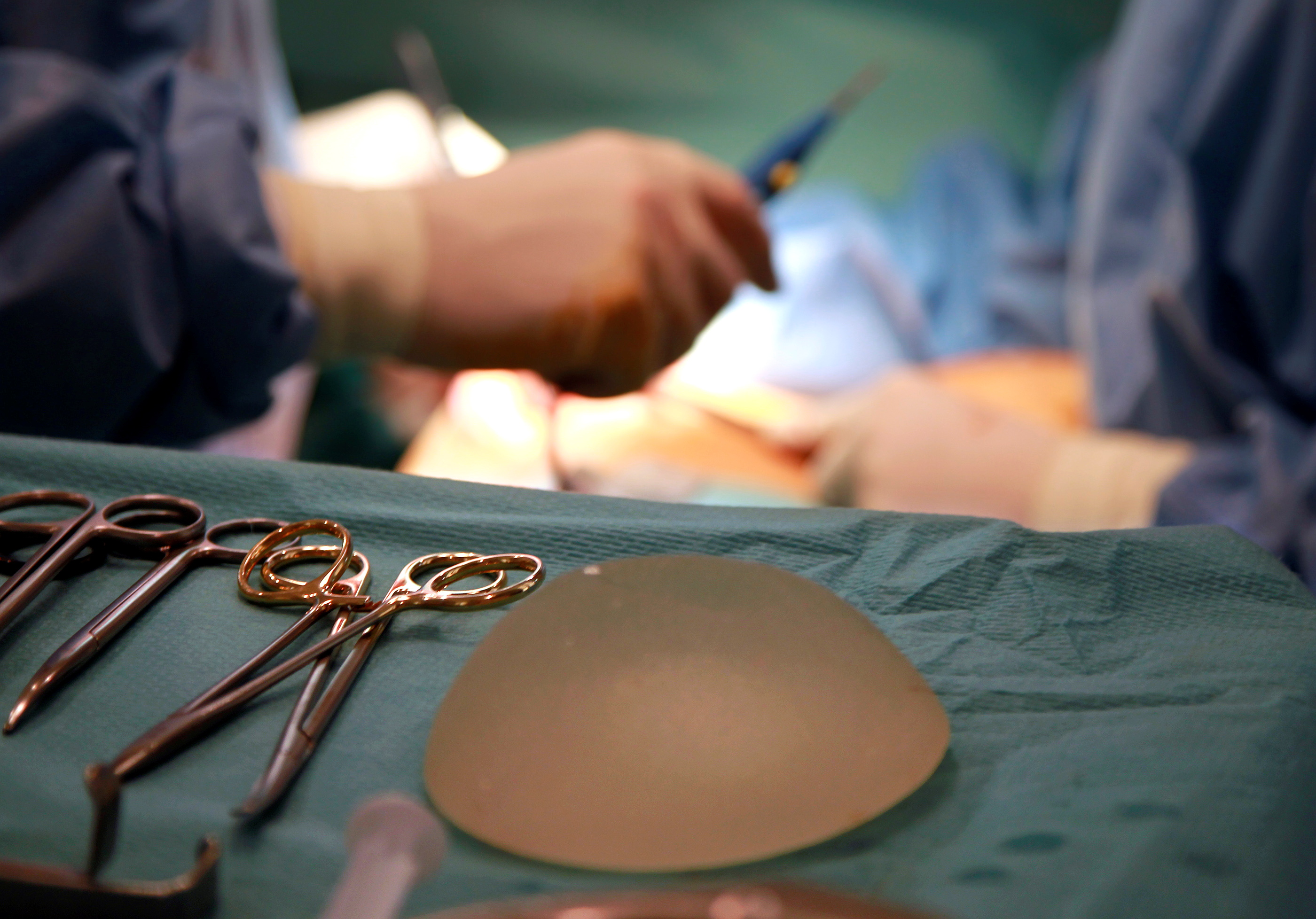 FILE PHOTO: Defective silicone gel breast implants, manufactured by French company Poly Implant Prothese, is seen near surgical instruments after being removed from a patient in Nice