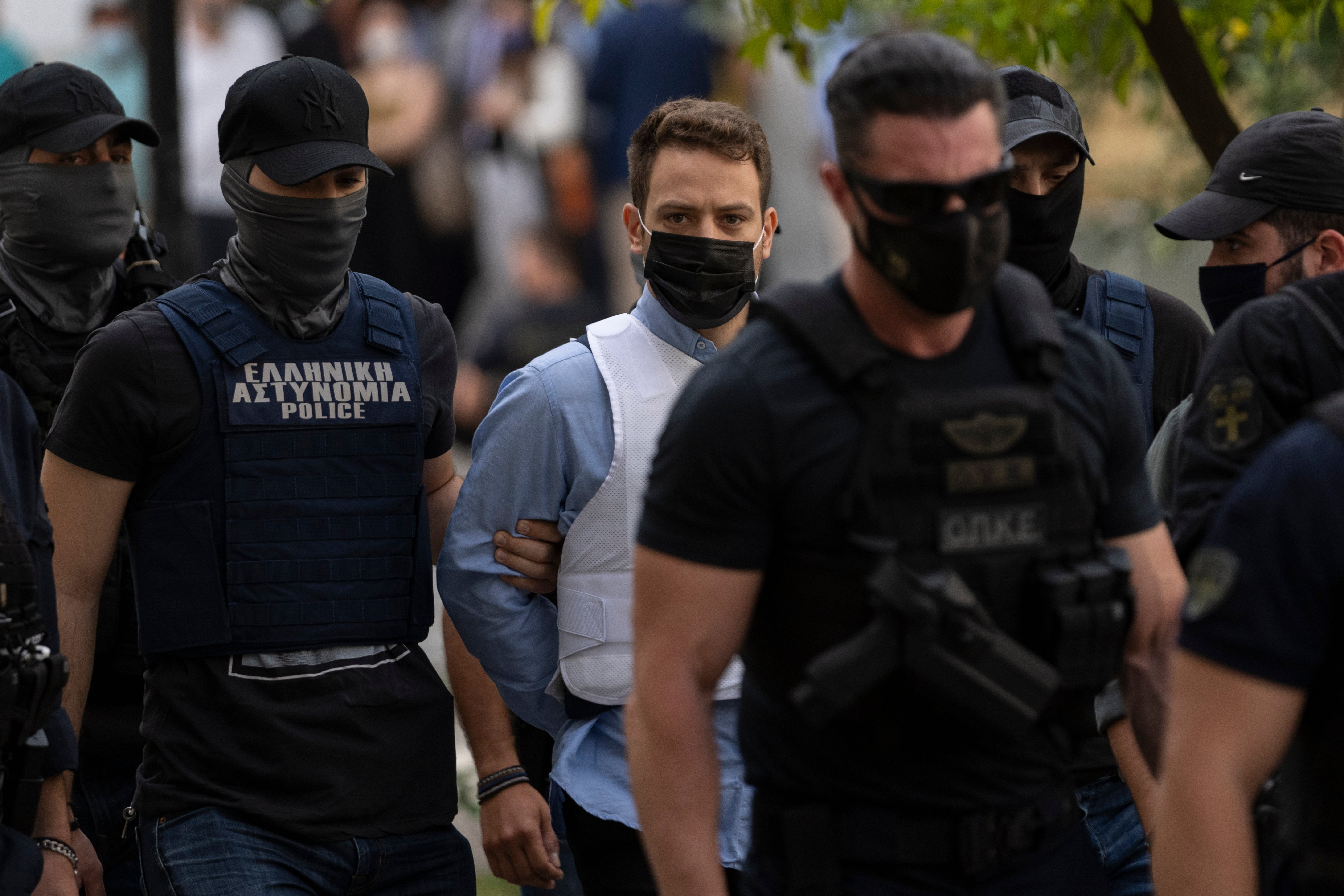 Greek pilot Babis Anagnostopoulos appears in court wearing bullet proof vest