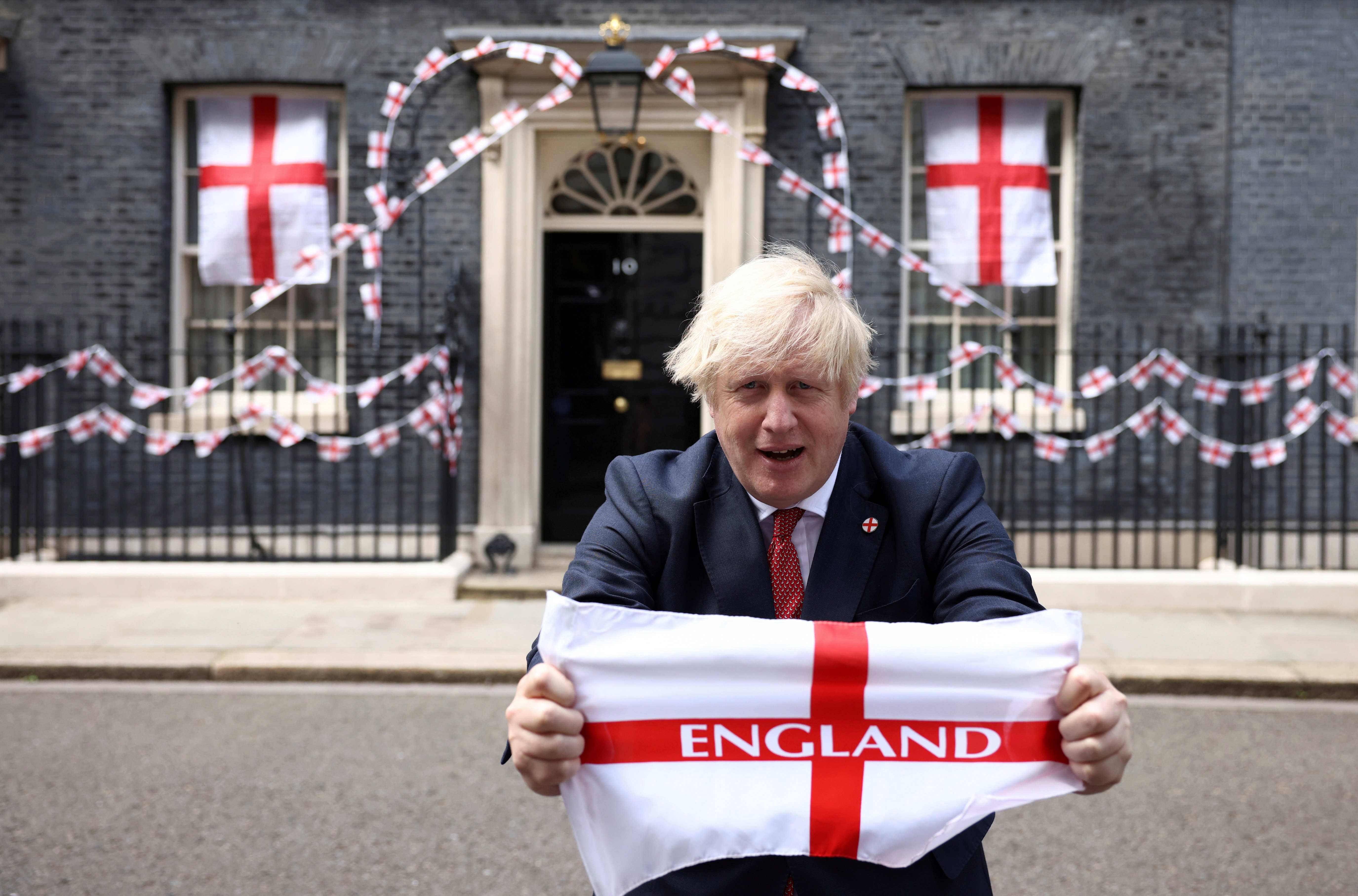 Britain's Boris Johnson at Downing Street with flags ahead of the Euro 2020 final