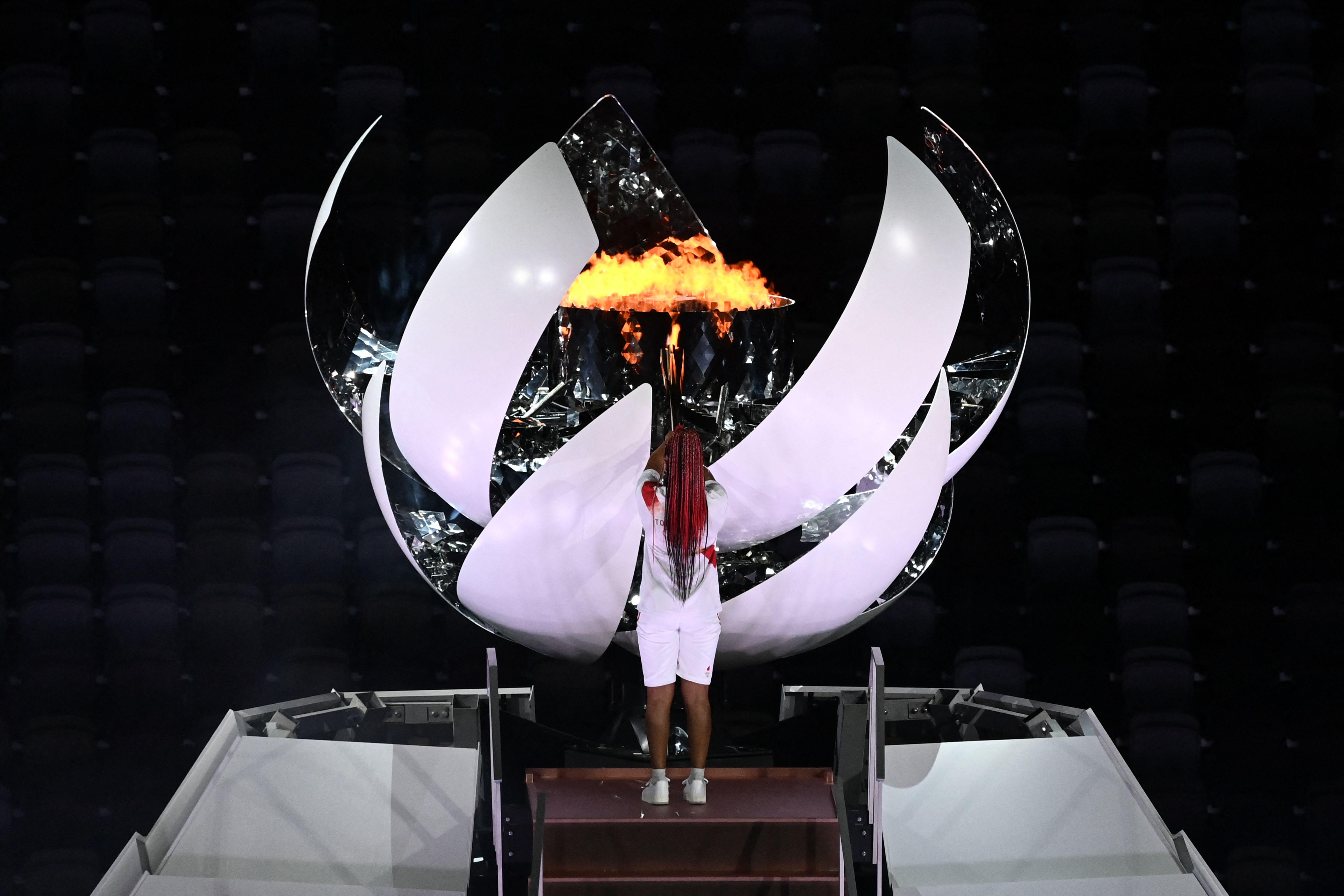 Let the Games begin (at last!): Tennis player Naomi Osaka lights flame as Tokyo Olympics begins