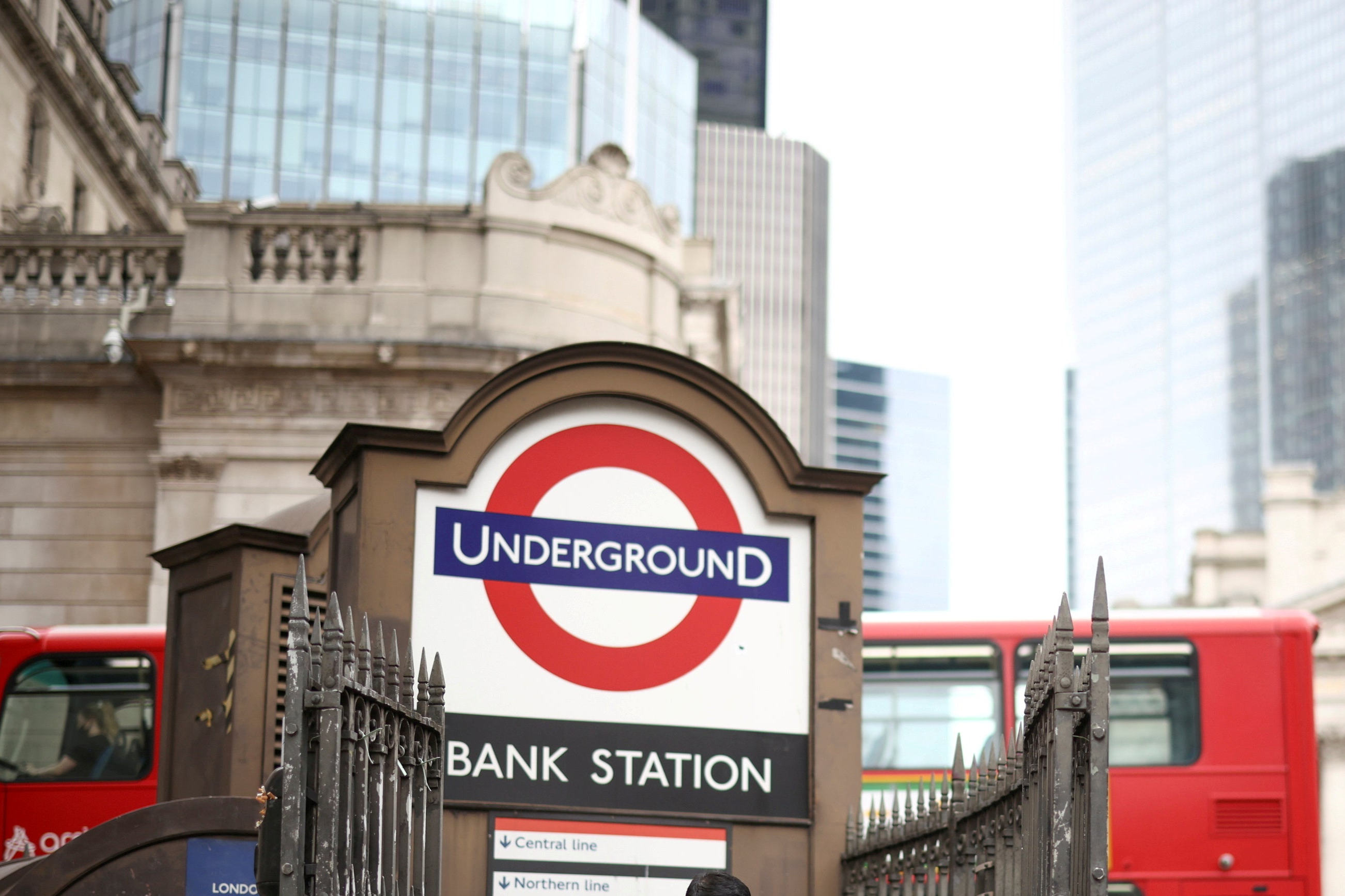 FILE PHOTO: A person exits Bank underground station in the City of London financial district