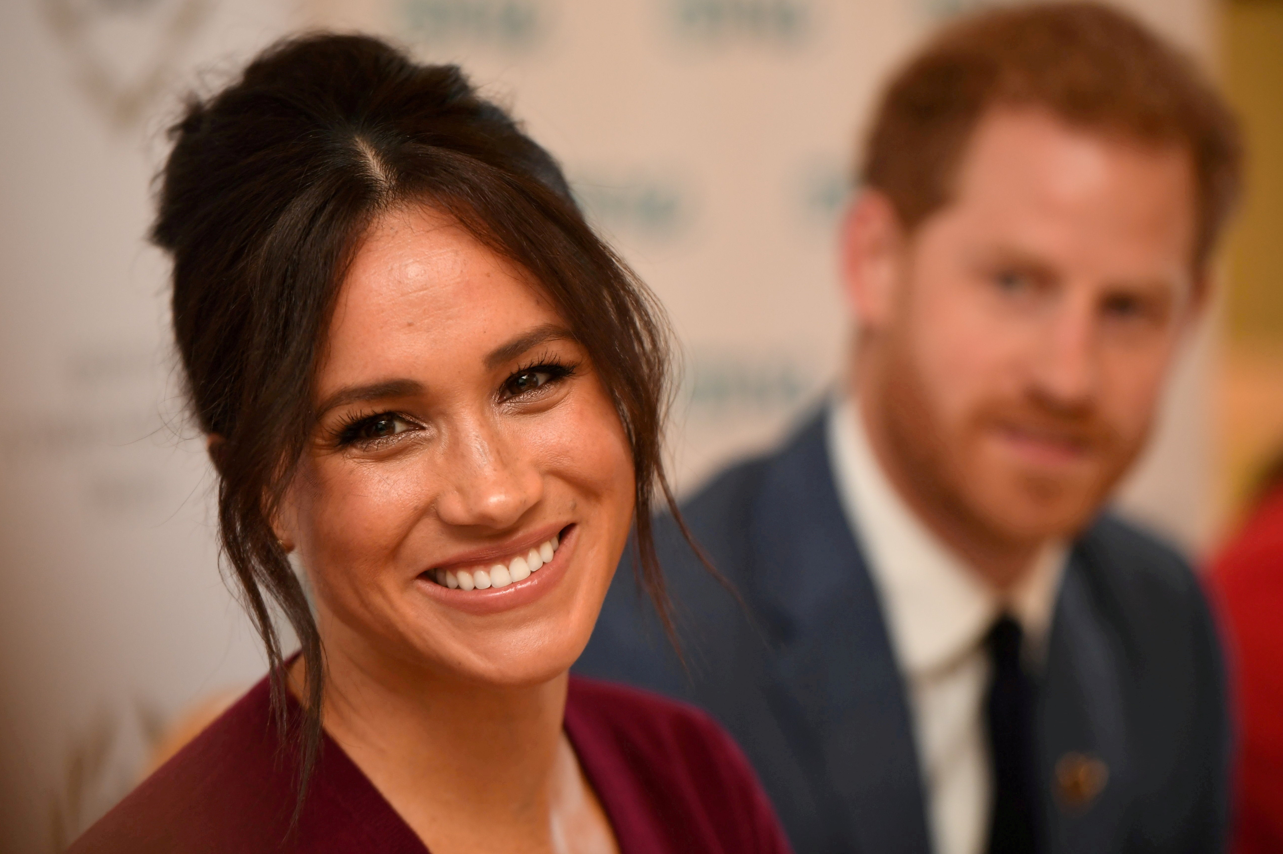 FILE PHOTO: Britain's Meghan, the Duchess of Sussex, and Prince Harry, Duke of Sussex, attend a roundtable discussion on gender equality with The Queen's Commonwealth Trust (QCT) and One Young World at Windsor Castle