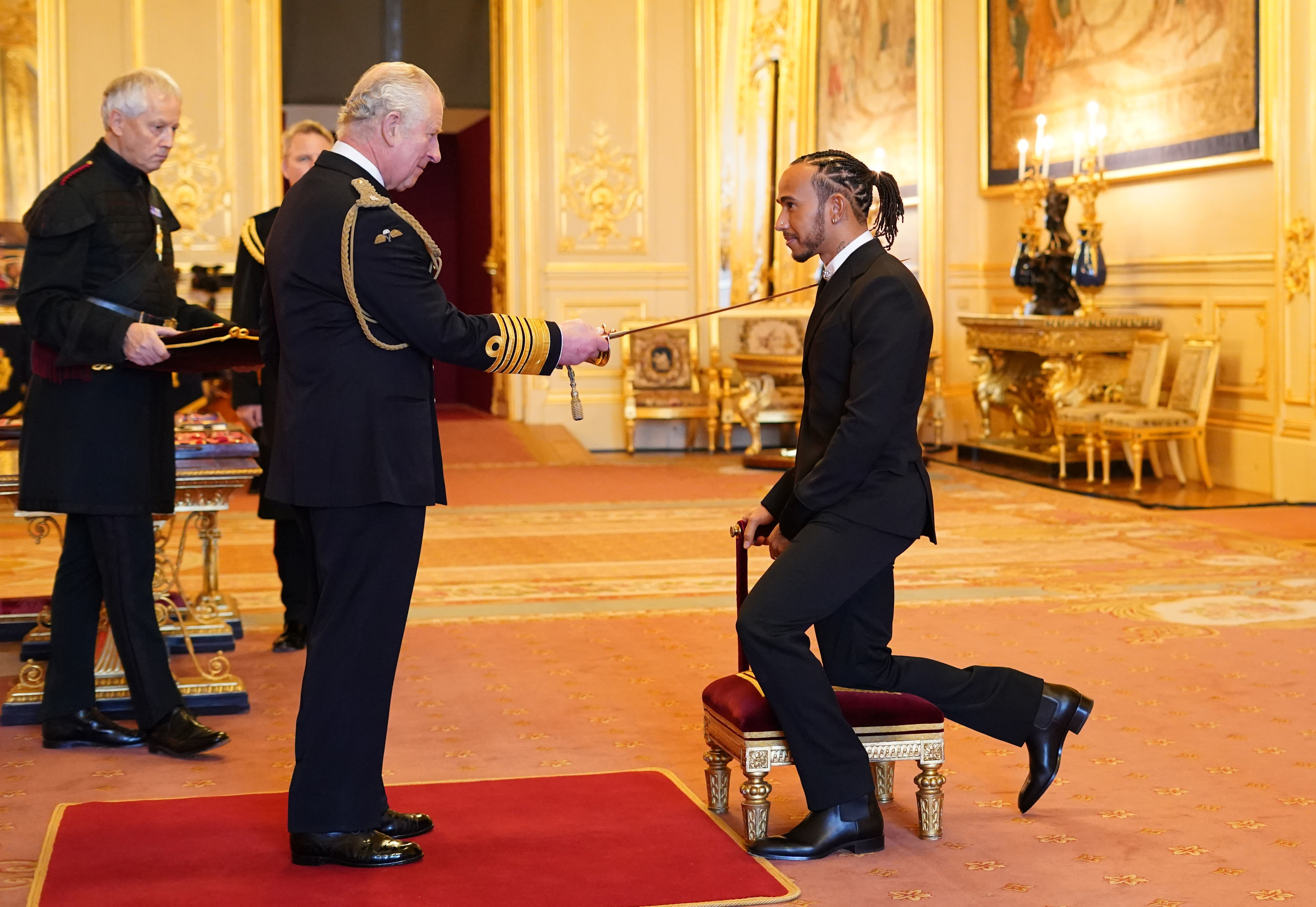 Lewis Hamilton knighted at Windsor Castle after being pipped to F1 title