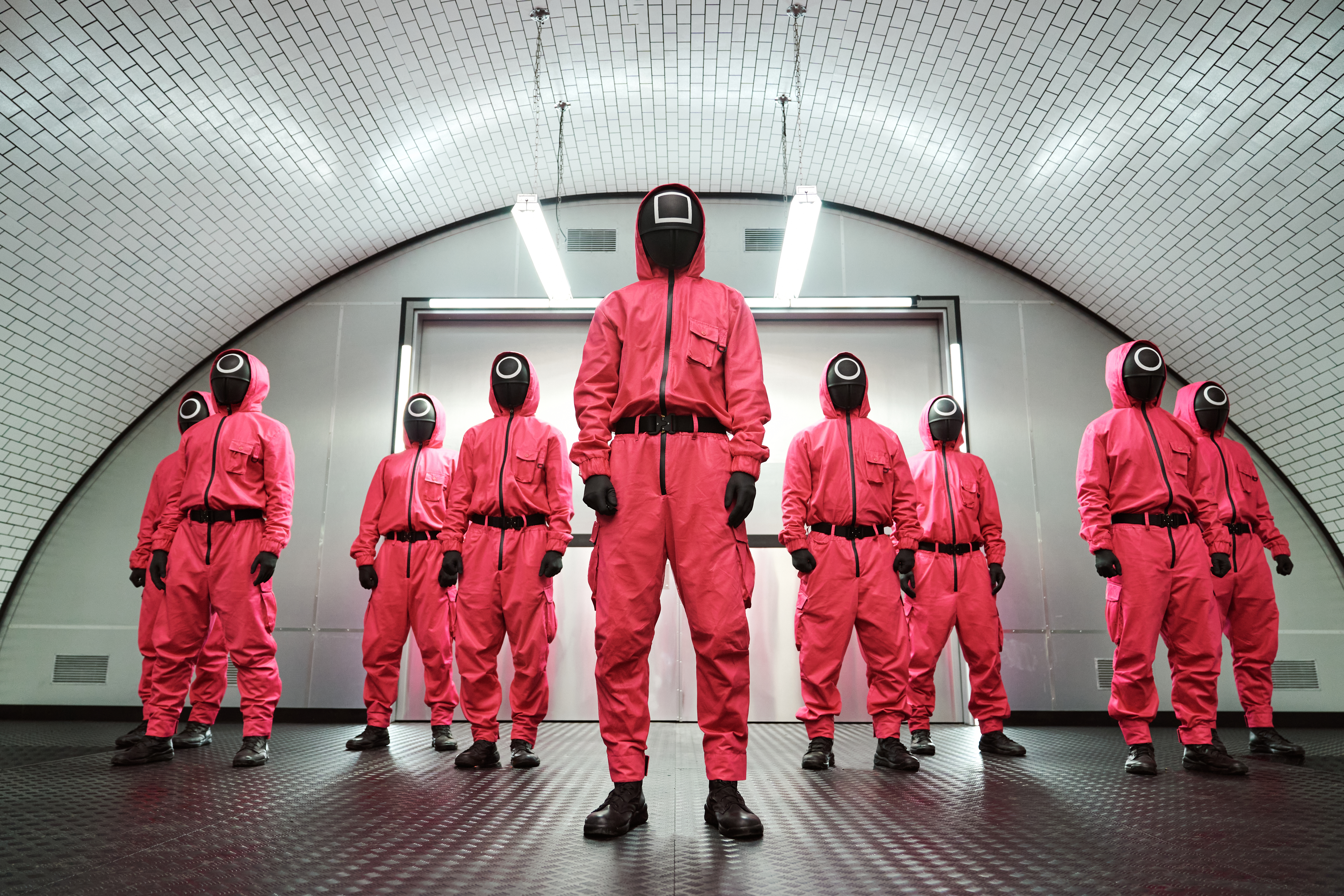 The guards standing together in Squid Game season 1