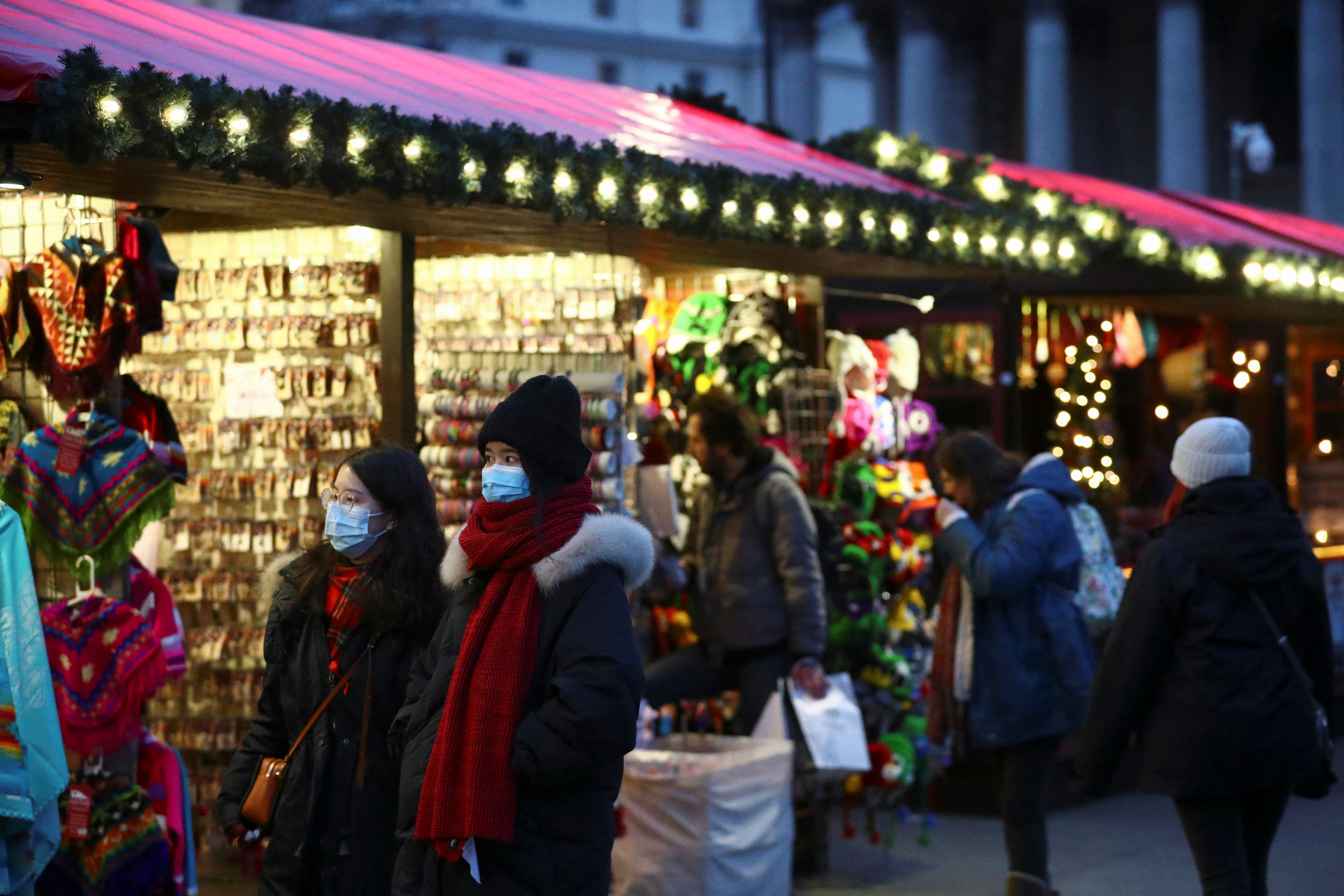 People visit a Christmas market in London