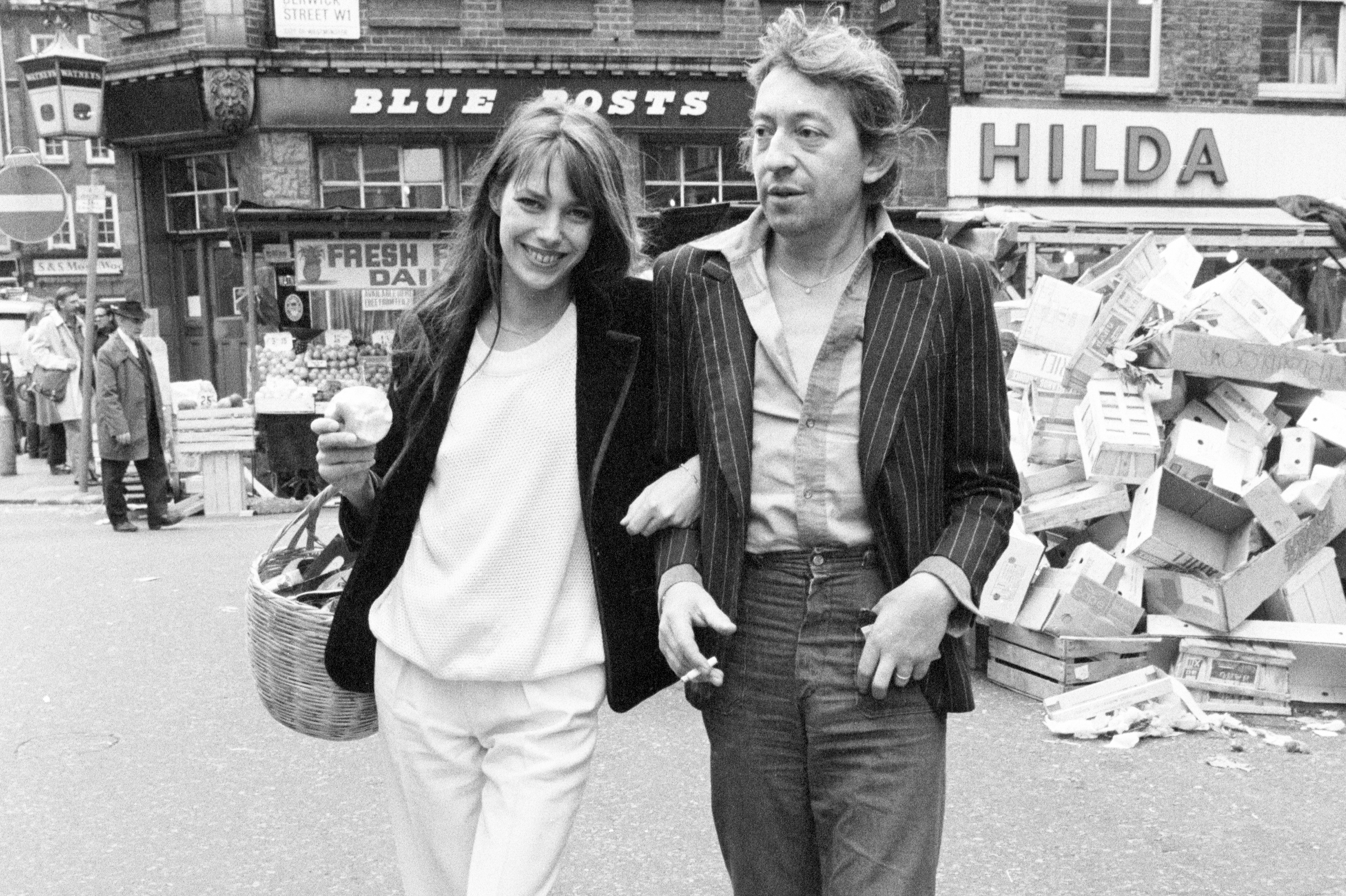 Jane Birkin and husband Serge Gainsbourg, pictured shopping in Berwick Street market, London, April 1977.