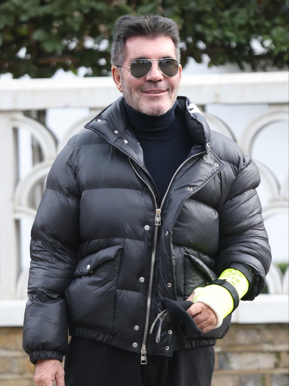 Simon Cowell broken arm