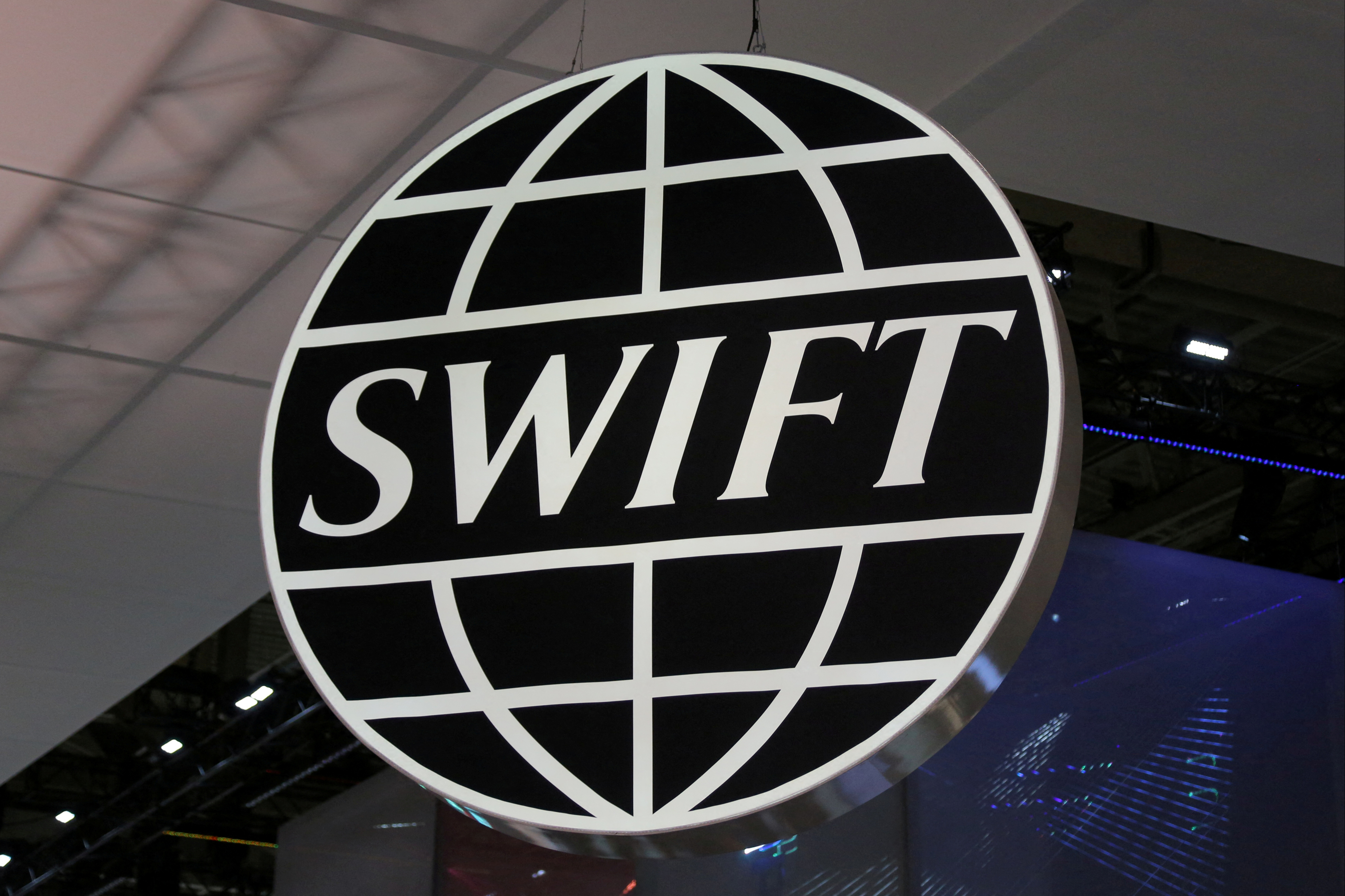 FILE PHOTO: The logo of global secure financial messaging services cooperative SWIFT is seen at the SIBOS banking and financial conference in Toronto