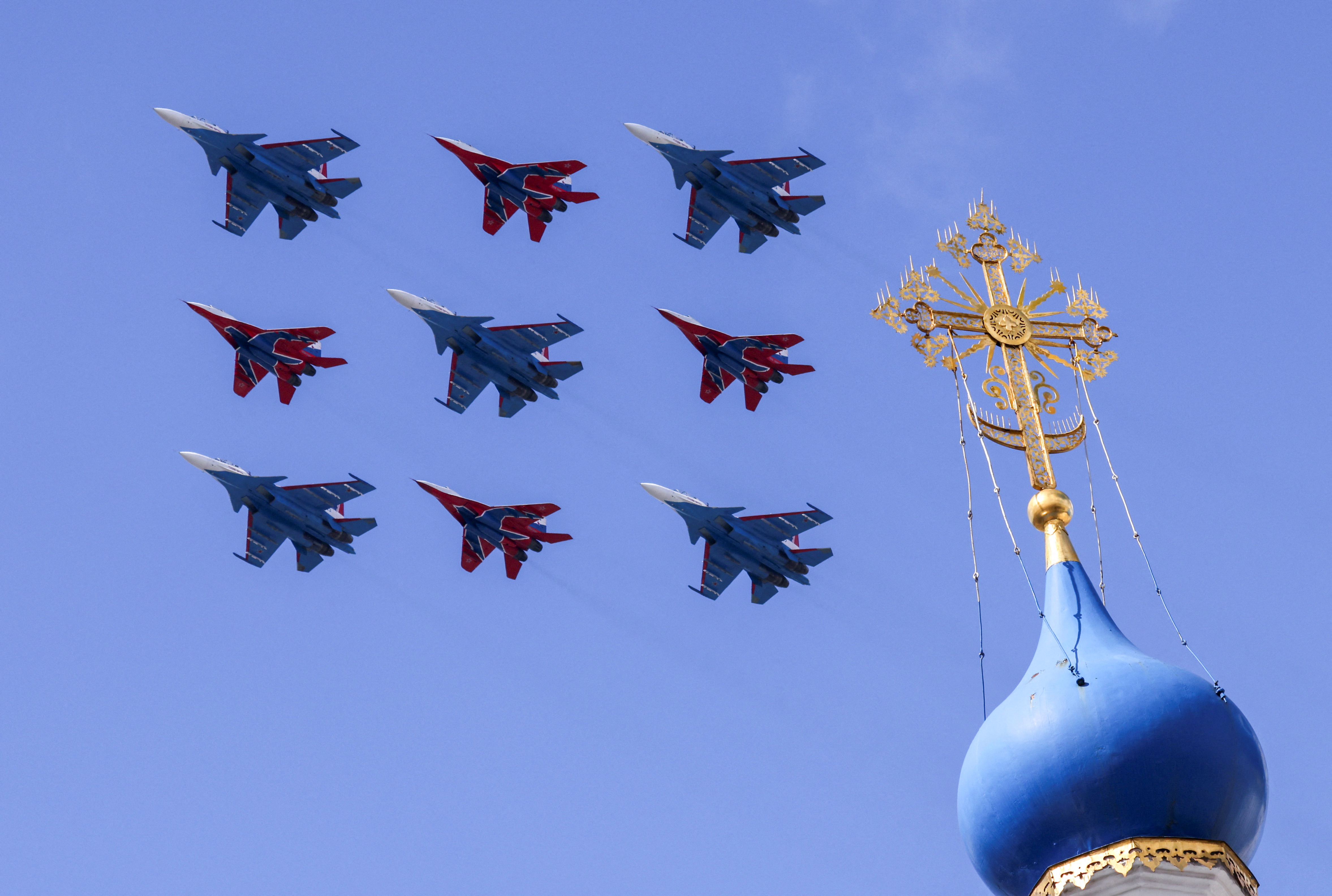 Russian military aircraft fly in formation during a rehearsal for the flypast in Moscow