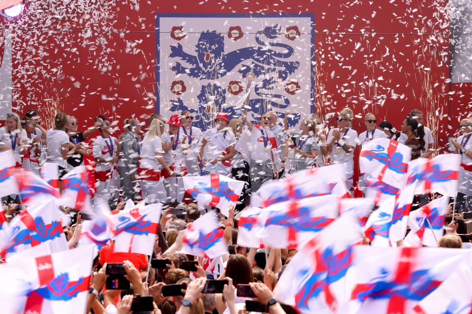 The Lionesses Lift The UEFA Women's Euro Trophy In Victory Celebration For Fans