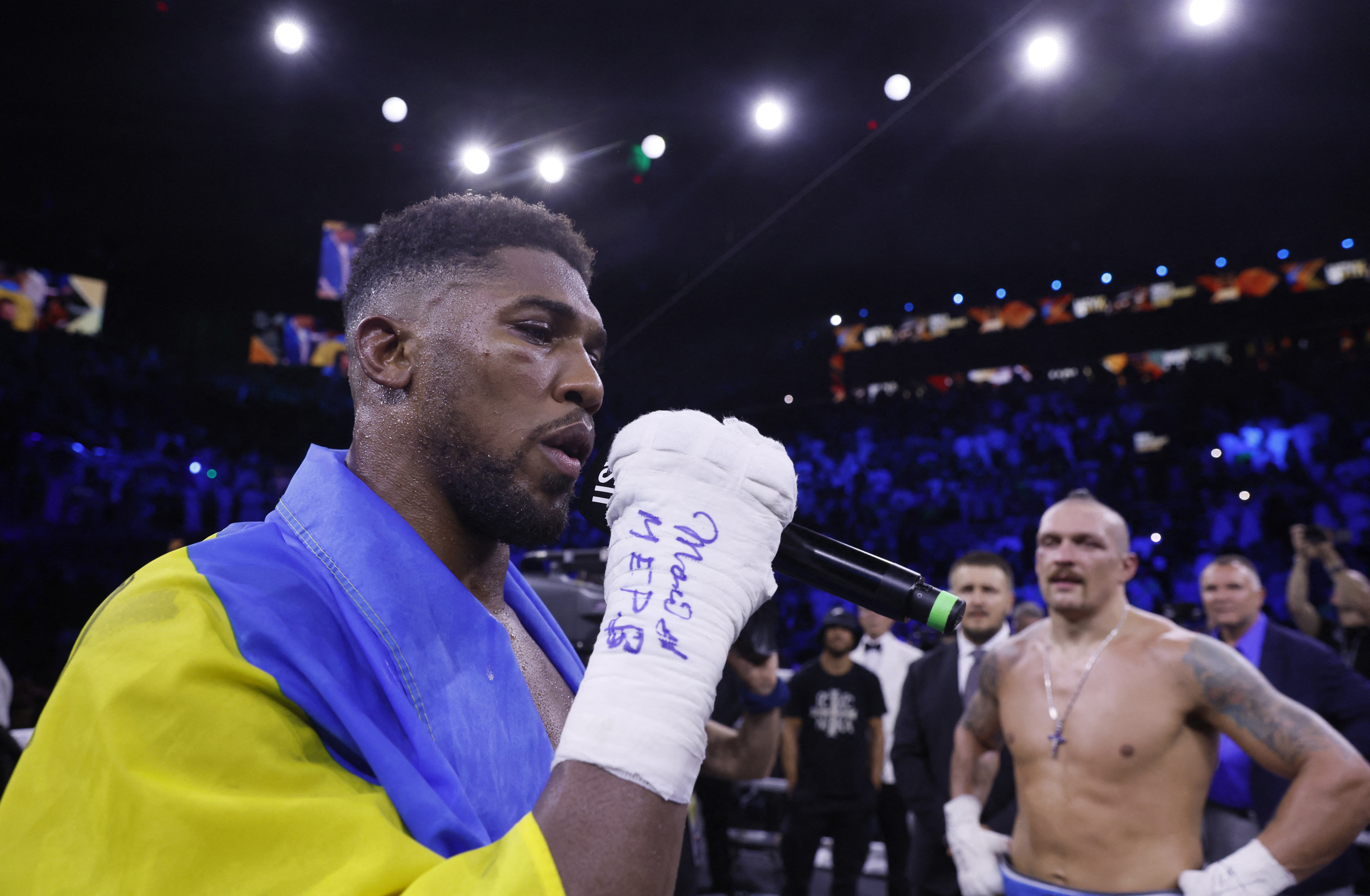 Anthony Joshua grabs microphone to address crowd in extraordinary outburst after Oleksandr Usyk defeat