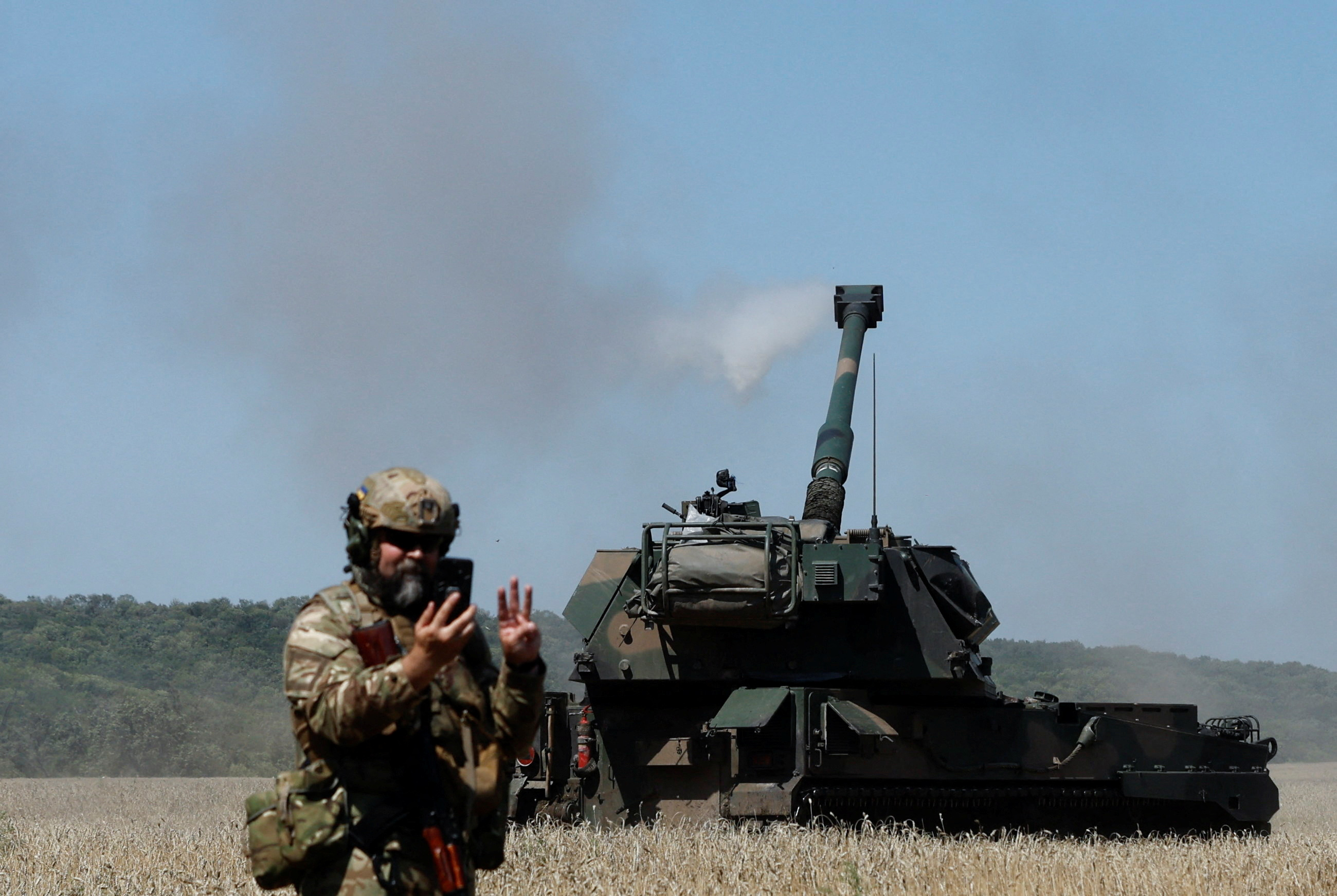 Ukrainian servicemen fire towards Russian troops on self-propelled AHS Krab howitzer, as Russia's attack in Ukraine continues, in Donetsk region