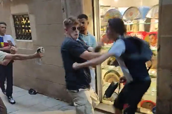 A British tourist suffered stab wounds after attempting to wrestle his bag off thieves