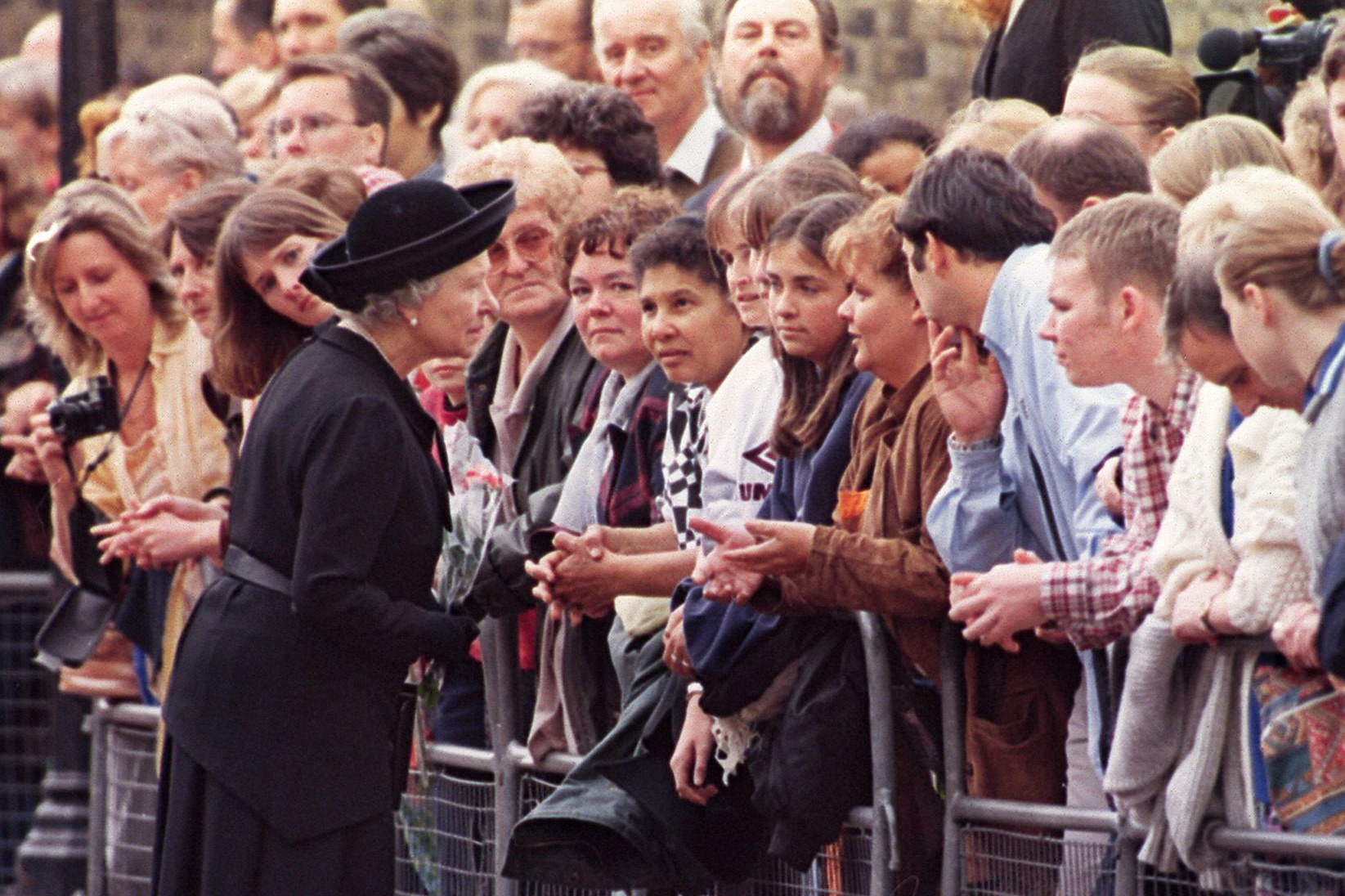 Queen Elizabeth II of England speaks to youths as